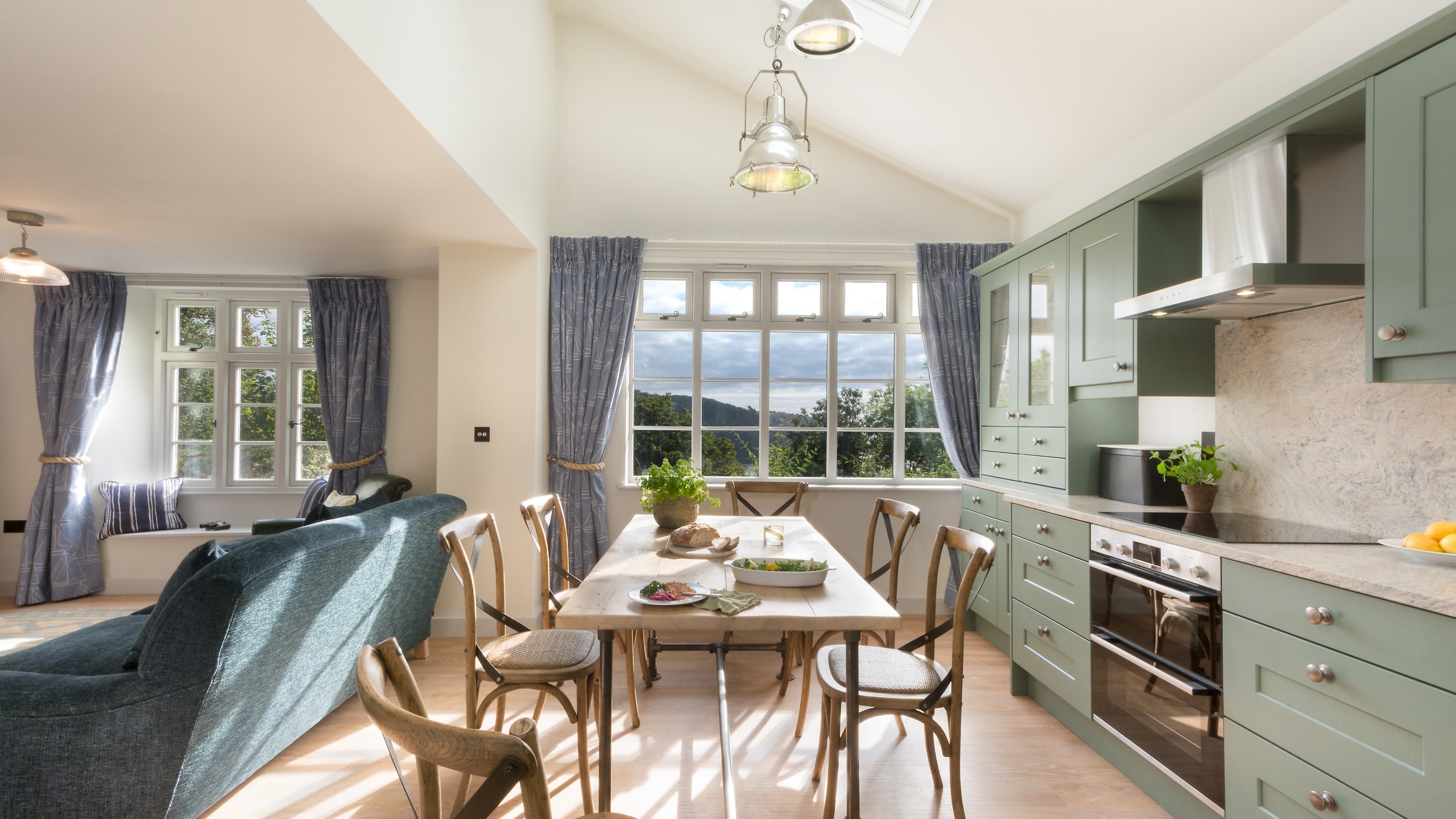 The open-plan kitchen, dining and sitting room at Compass Cottage, Devon