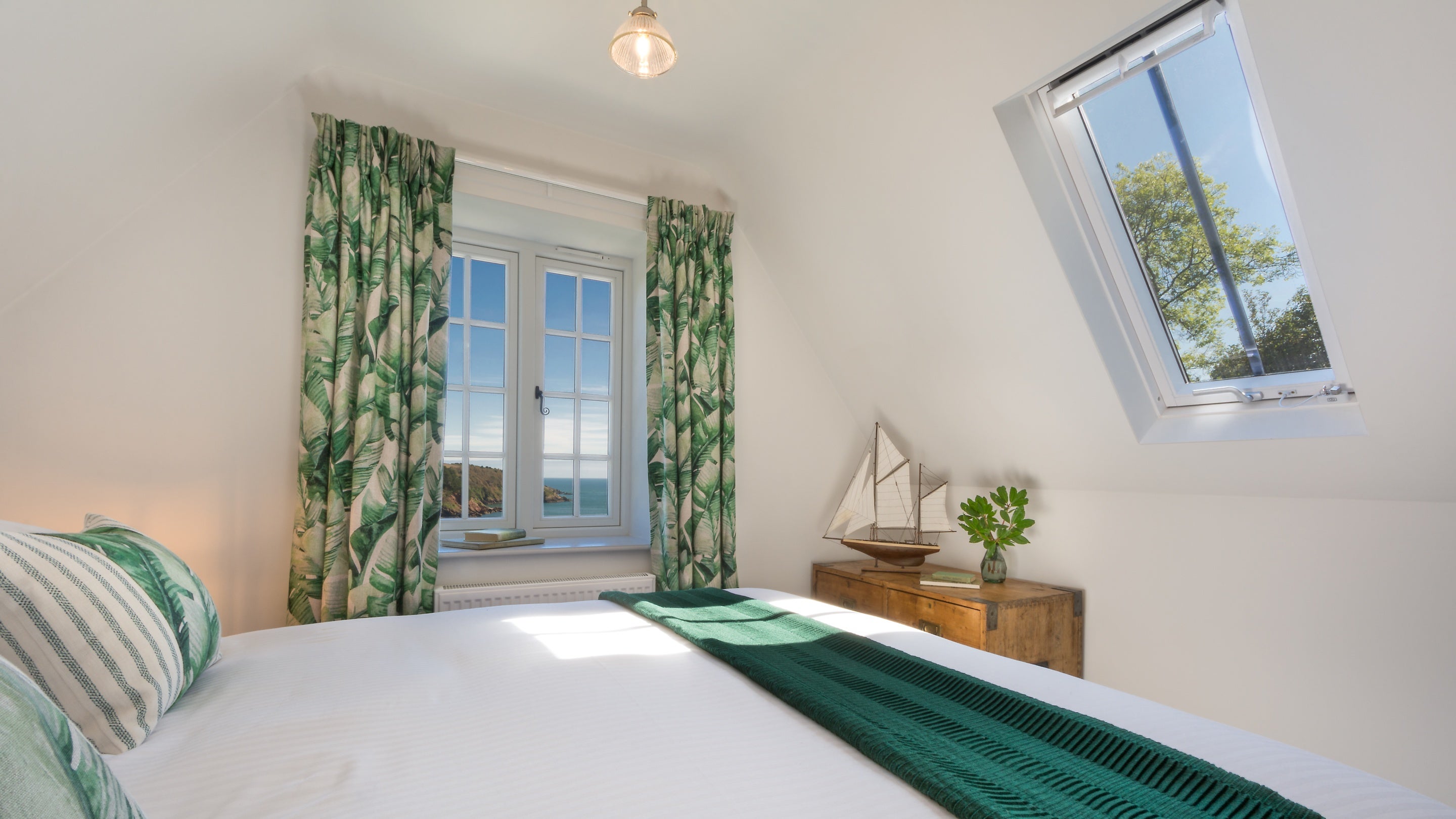 The second-floor double bedroom at Compass Cottage, with views of the Dart Estuary, Devon
