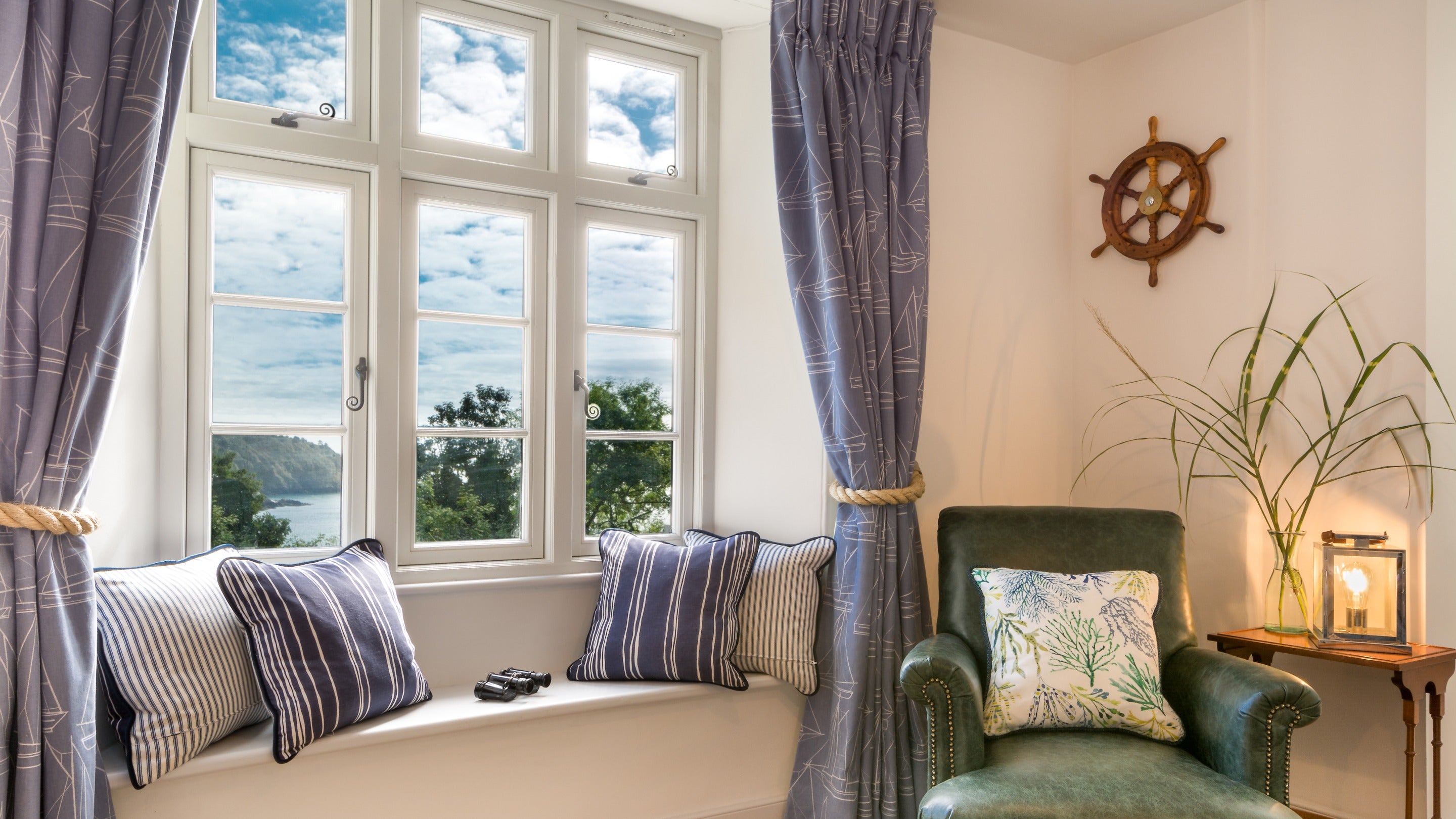 The sitting room window, with views of the Dart Estuary at Compass Cottage, Devon