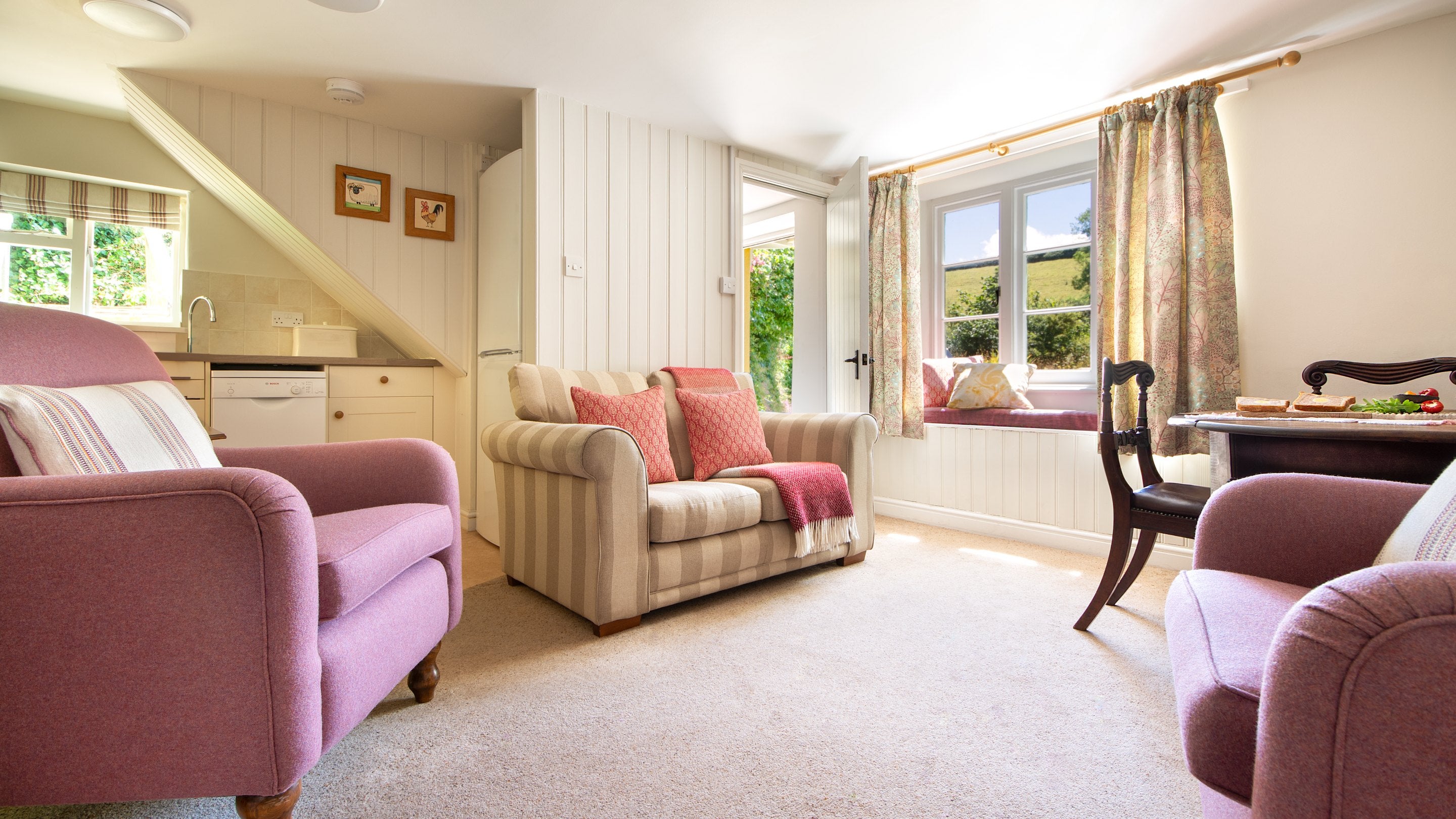 The open-plan kitchen, dining and sitting room at Crockers Cottage, Devon