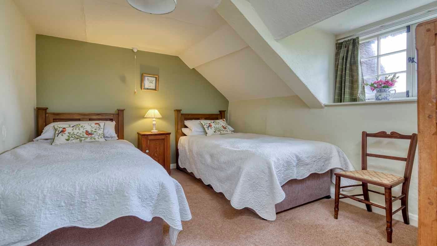 One of the twin bedrooms at Forest Cottage, near Exeter, Devon