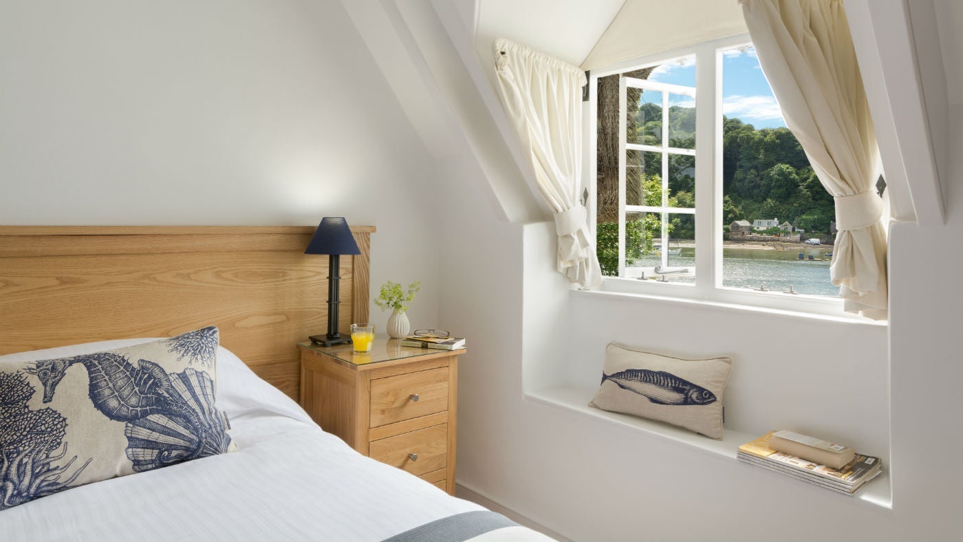 A bright double bedroom at Ferry Cottage, Brixham, Devon