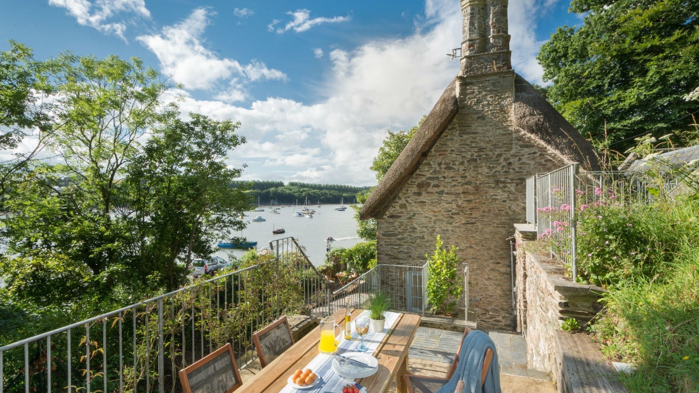 The idyllic outside dining area at Ferry Cottage, Brixham, Devon