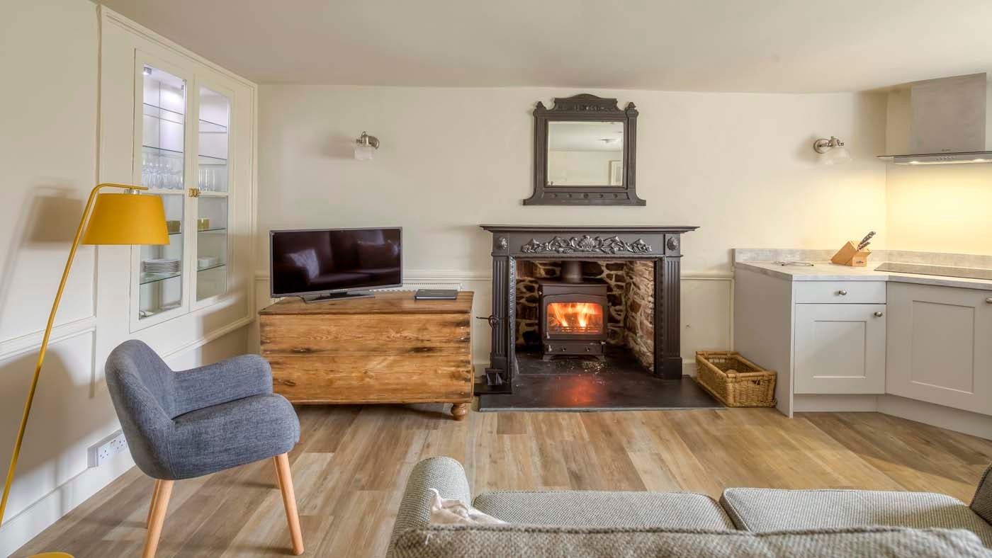 The open plan sitting room, kitchen and dining area at Kipscombe Cottage, Devon