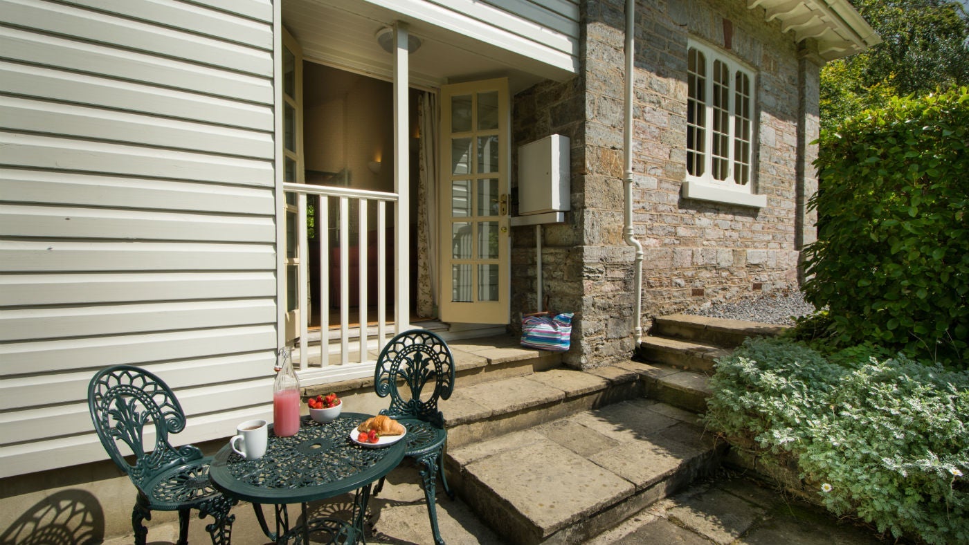The secluded patio garden at The Lodge at Greenway, Brixham, Devon