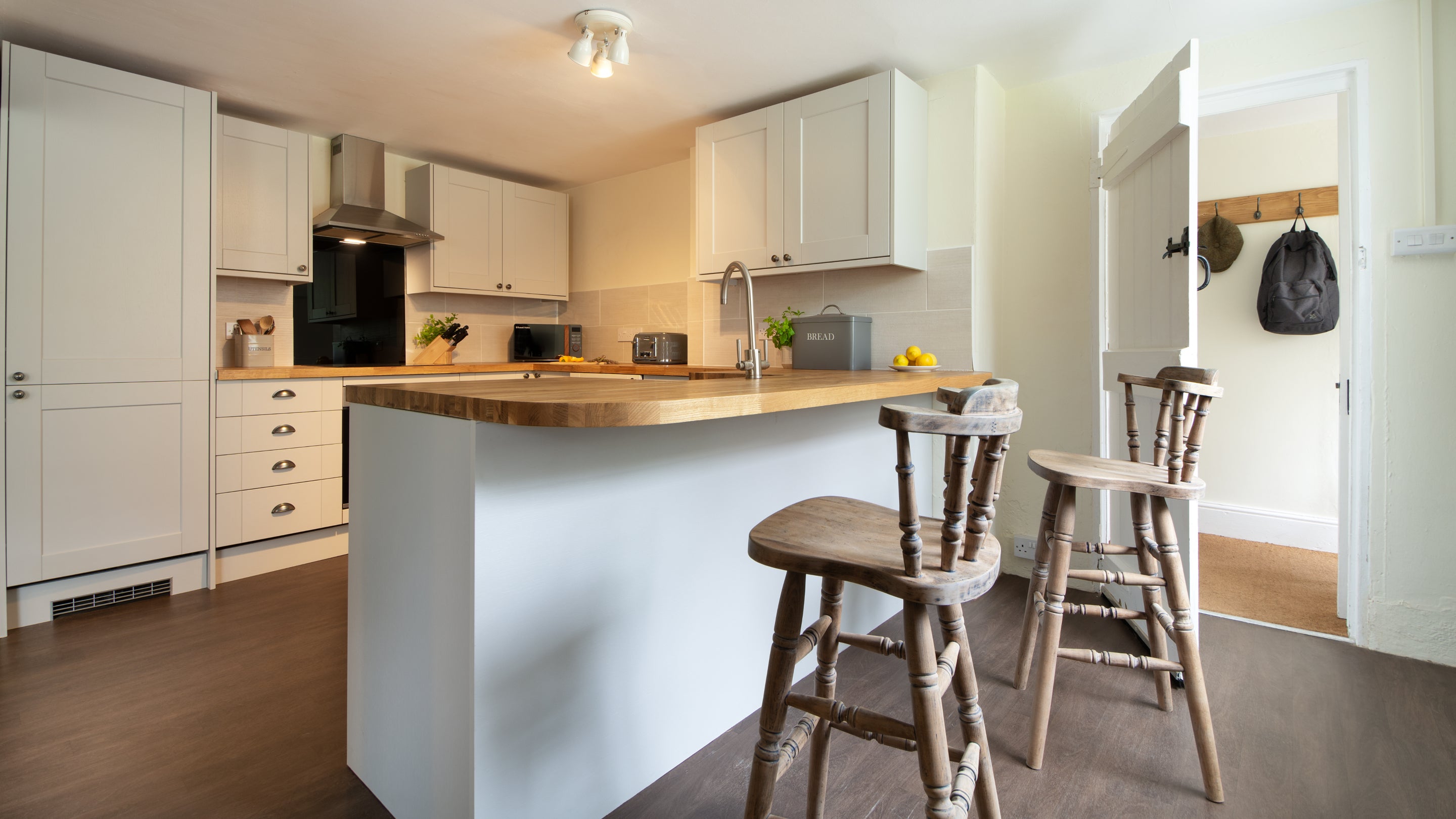The open-plan kitchen, sitting and dining room at Riverside Cottage, Devon