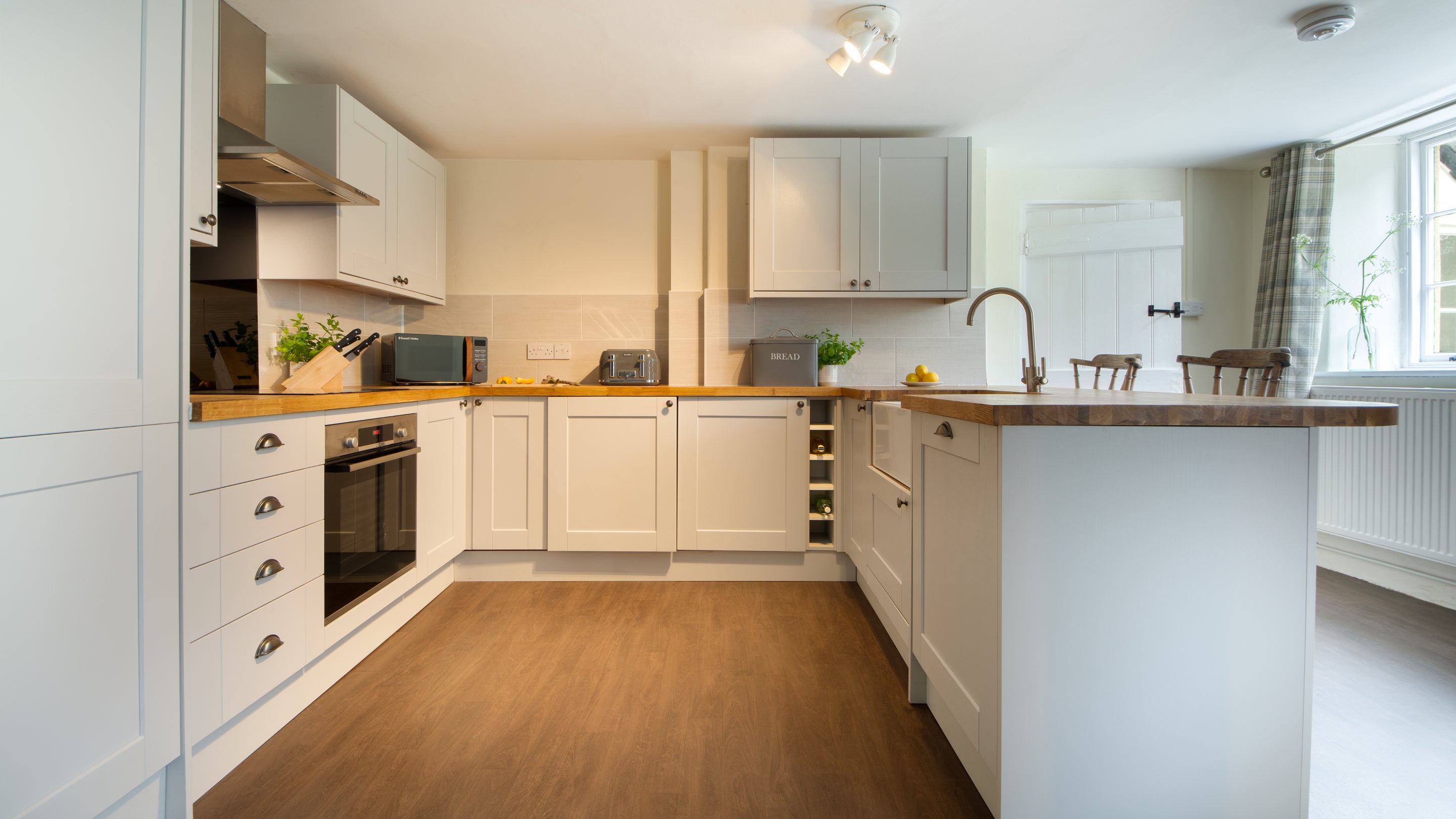 The open-plan kitchen, sitting and dining room at Riverside Cottage, Devon