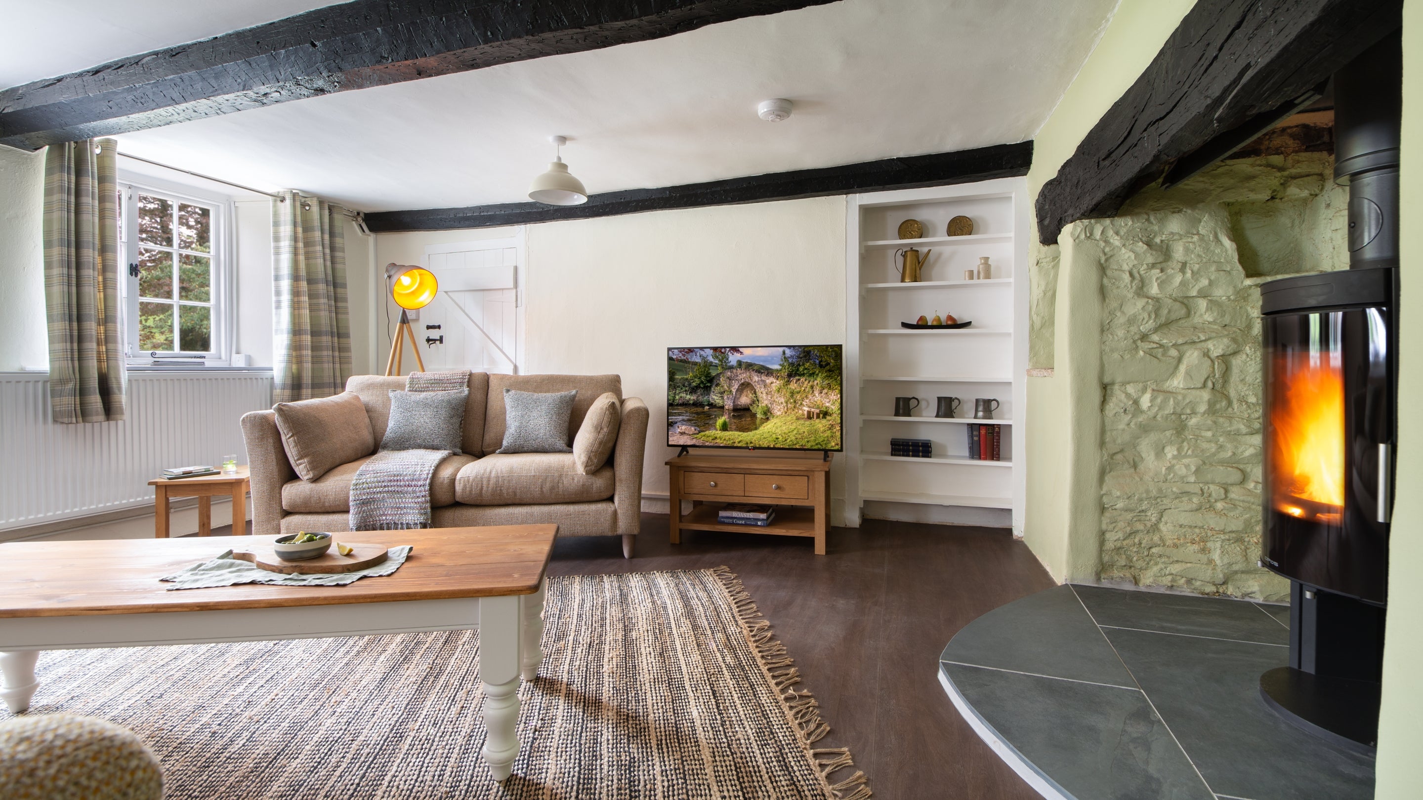 The open-plan kitchen, sitting and dining room at Riverside Cottage, Devon