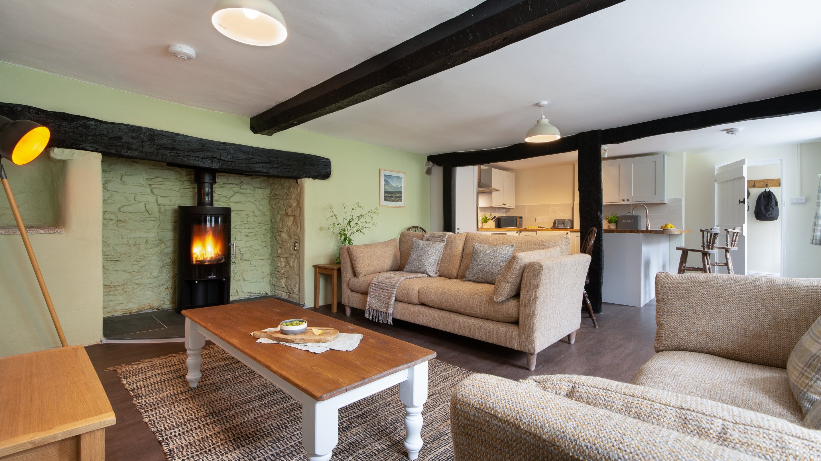 The open-plan kitchen, sitting and dining room at Riverside Cottage, Devon