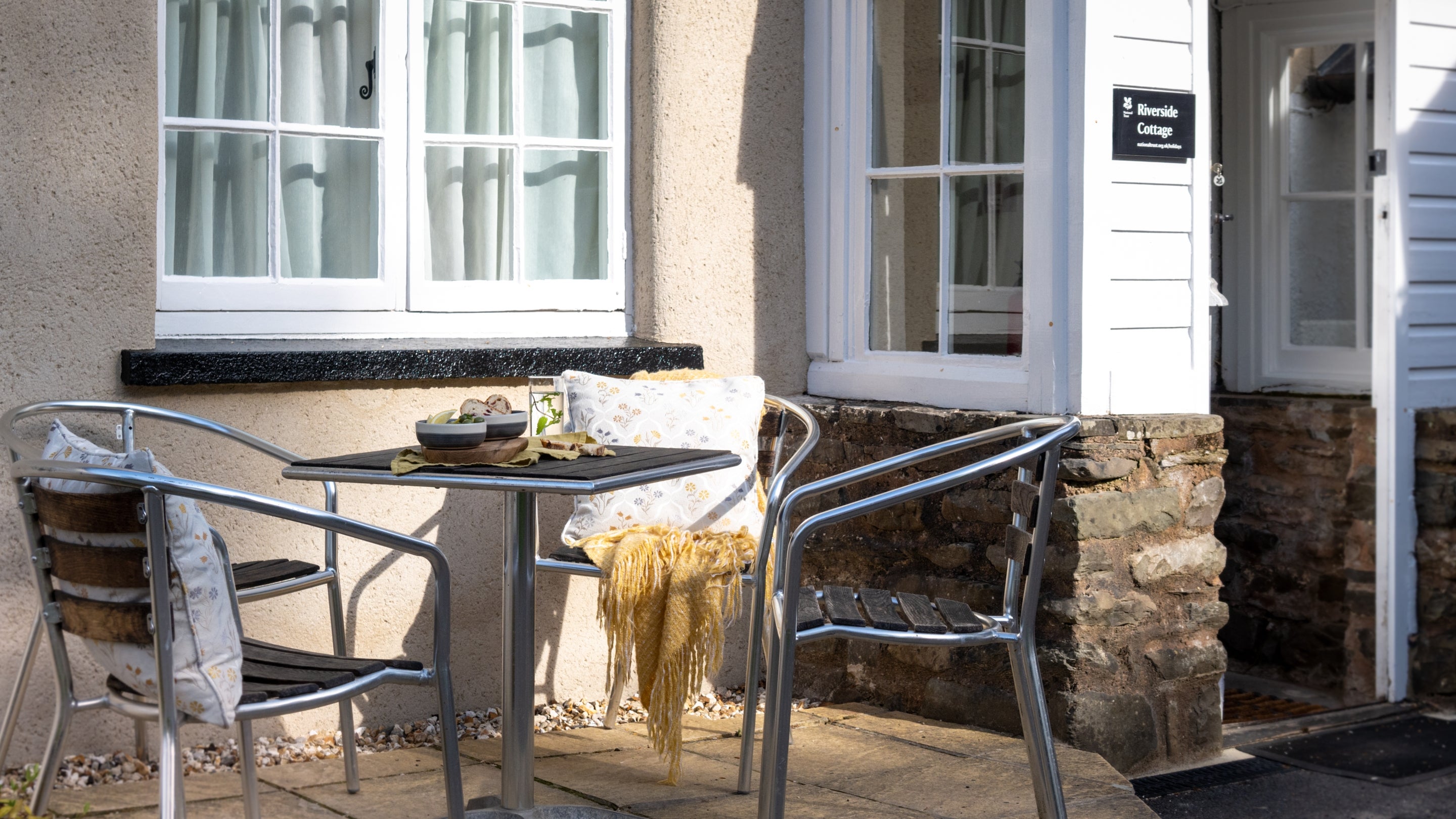 The outdoor seating area at Riverside Cottage, Devon