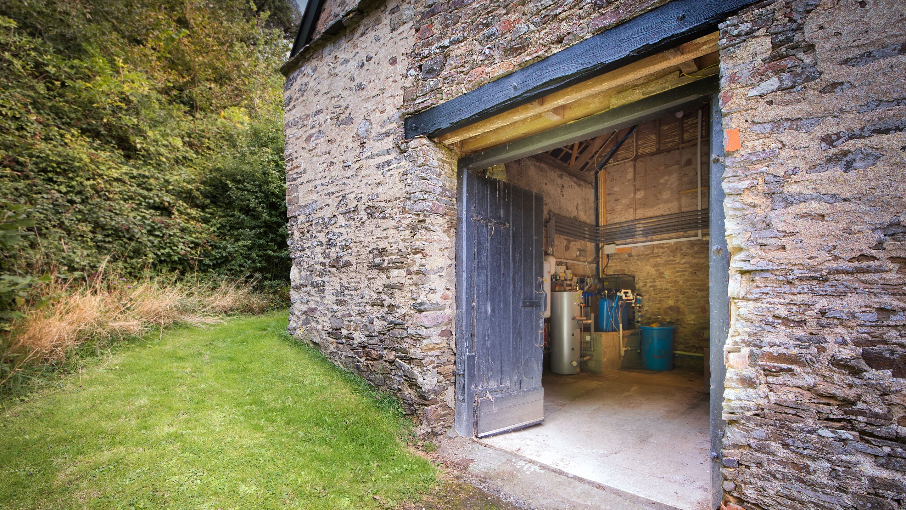 The barn with space to store bicycles and surfboards at West Challacombe Cottage, Devon