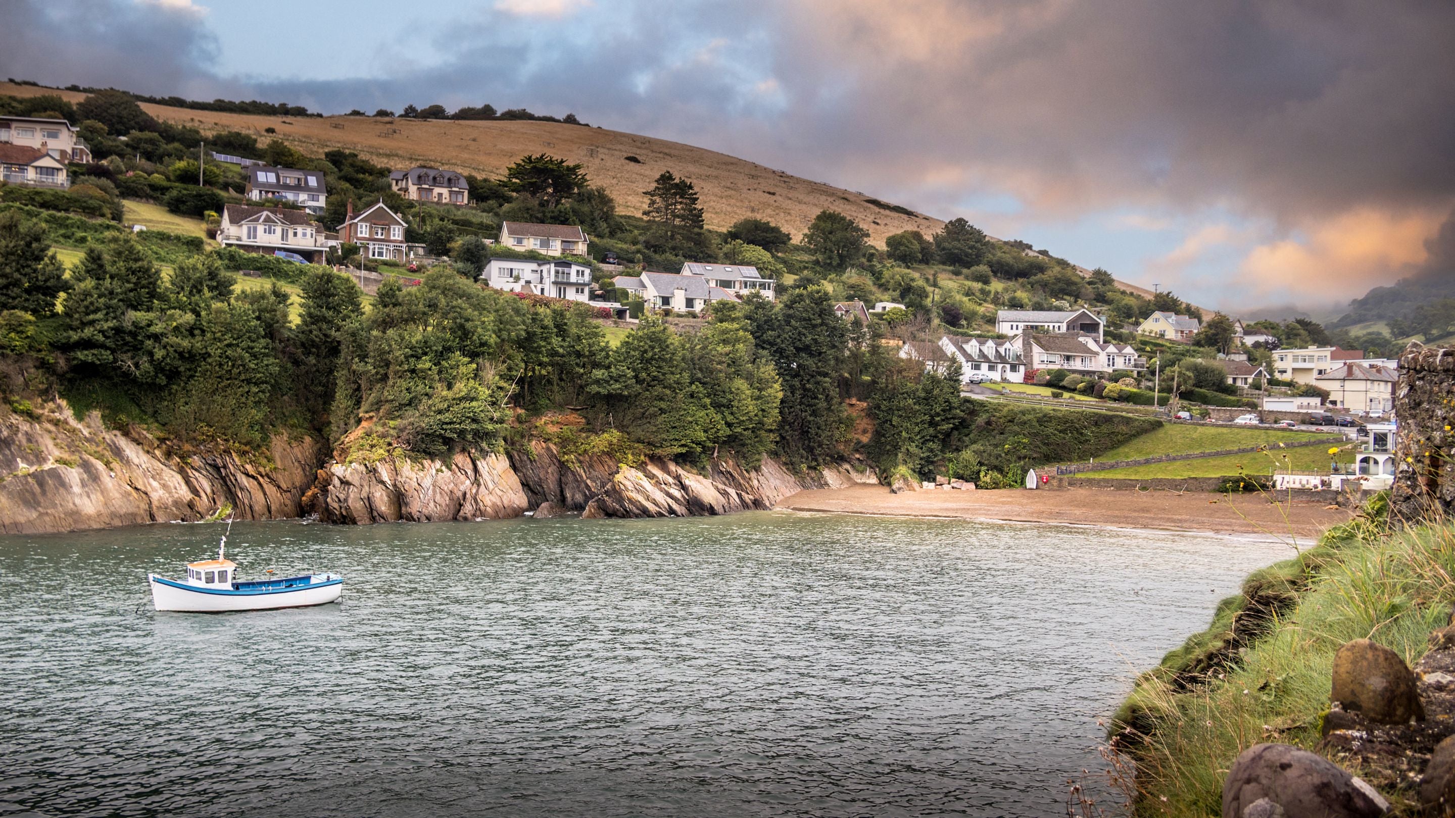 Looking across the bay to the beach at Combe Martin village, near West Challacombe Manor and Cottage, Devon