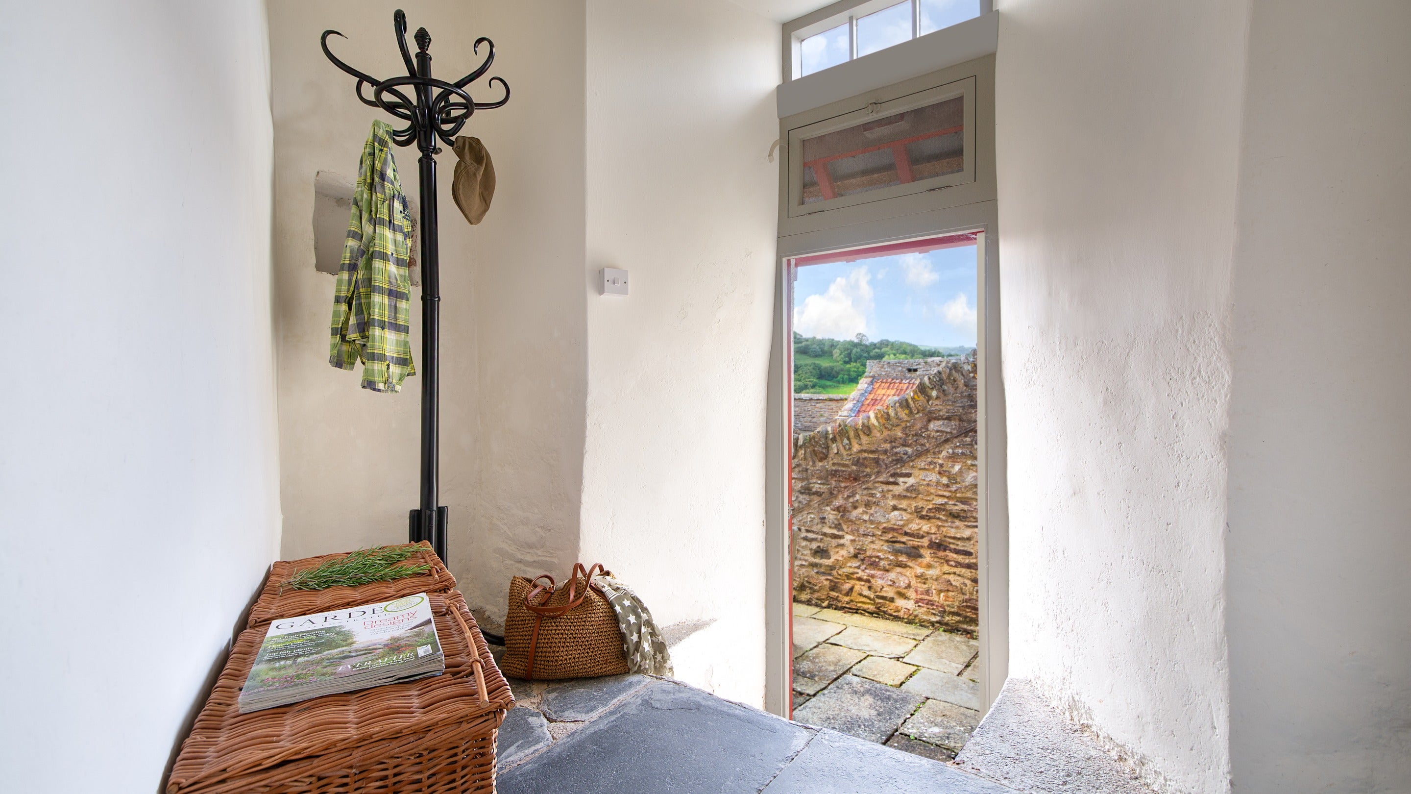 The cloakroom with door to the terrace at West Challacombe Manor, Devon