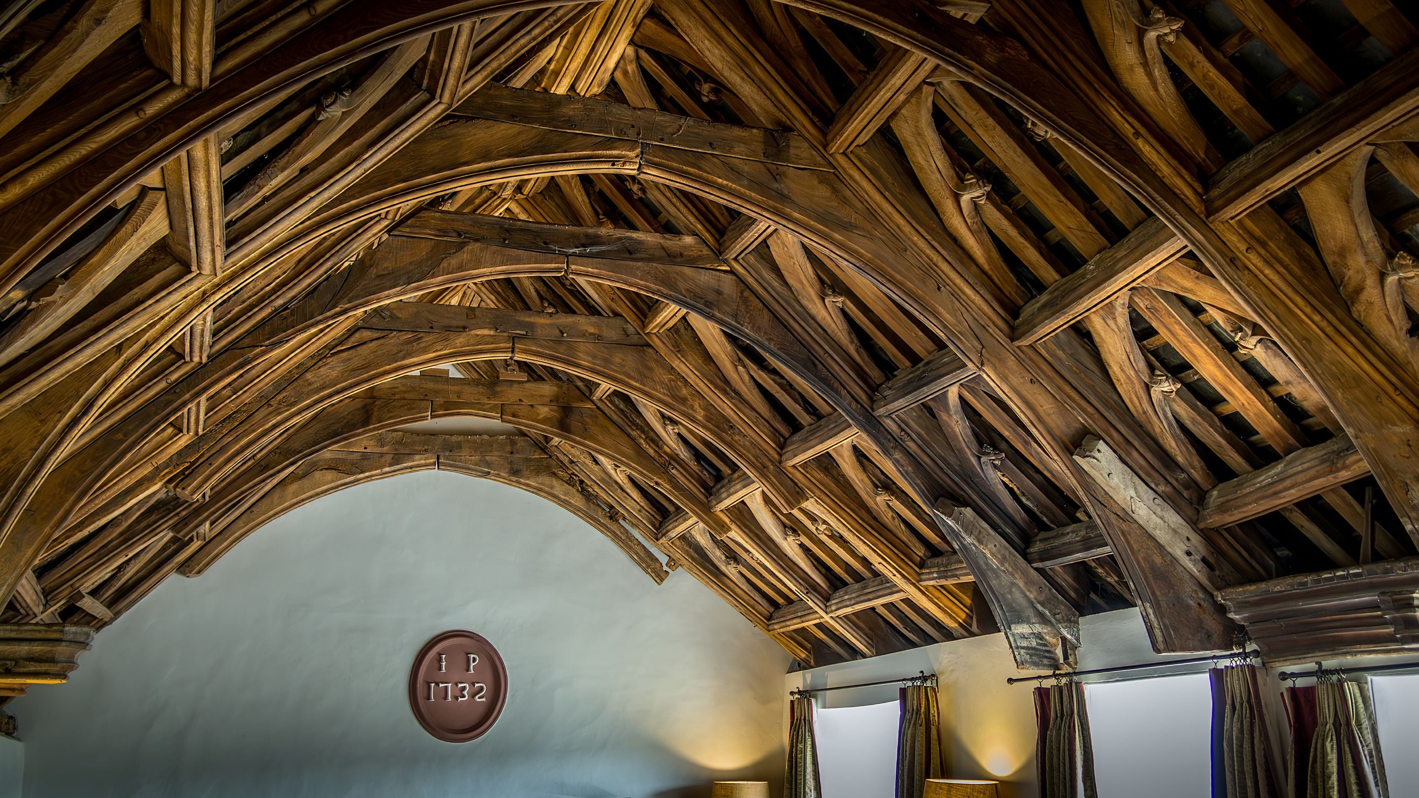 The vaulted, oak hammer beam ceiling in the great hall at West Challacombe Manor, Devon