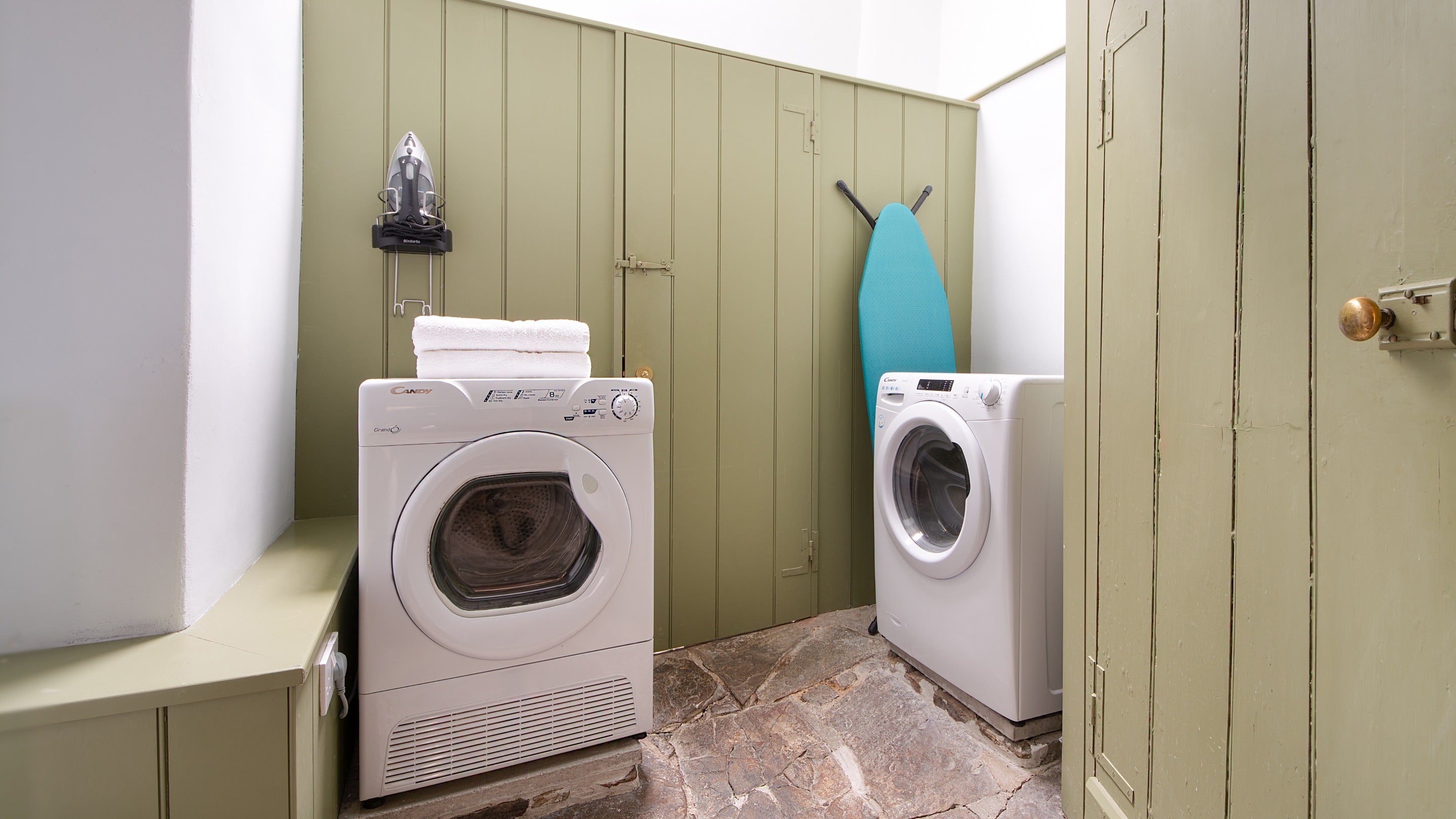 The utility room with washing machine, tumble dryer at West Challacombe Manor, Devon