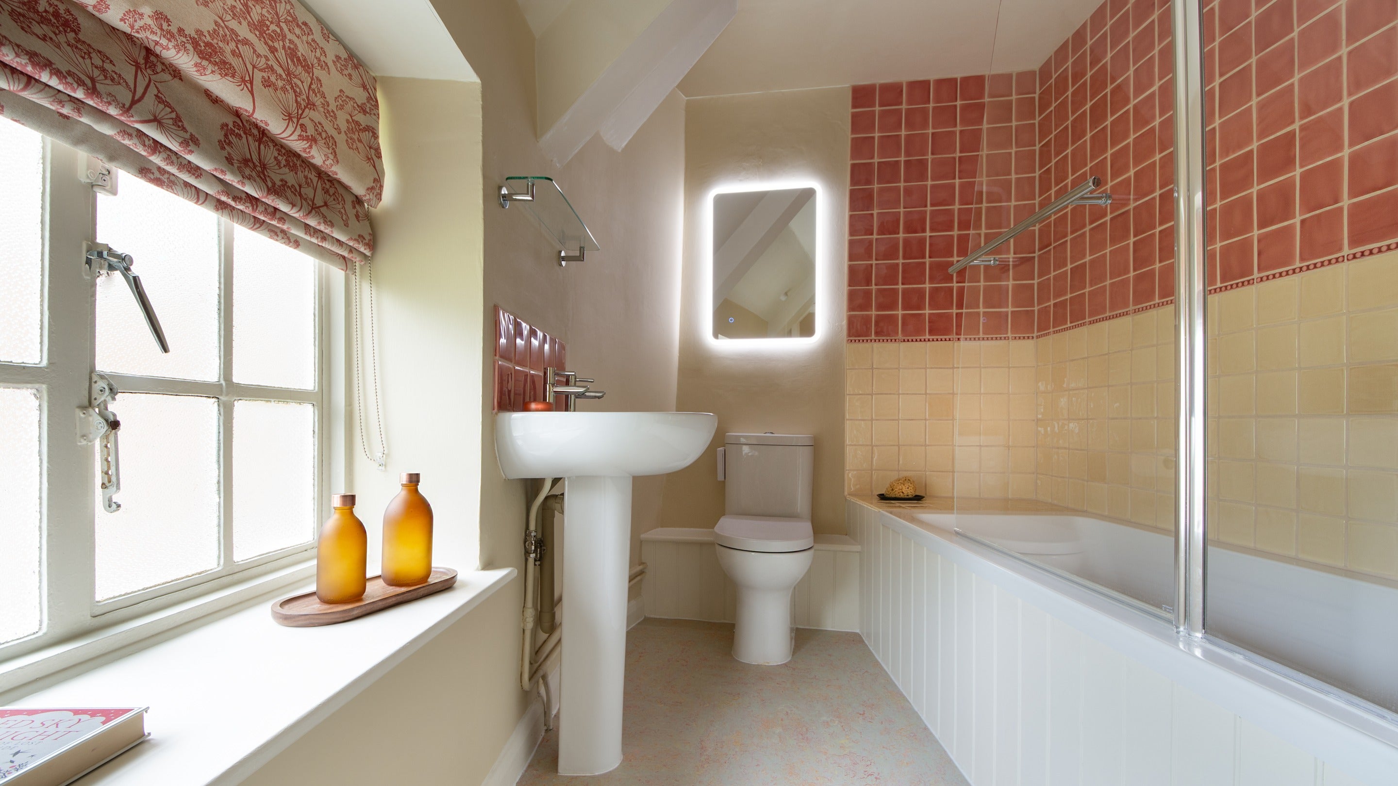 The bathroom with shower over bath at Beech Cottage, Dorset
