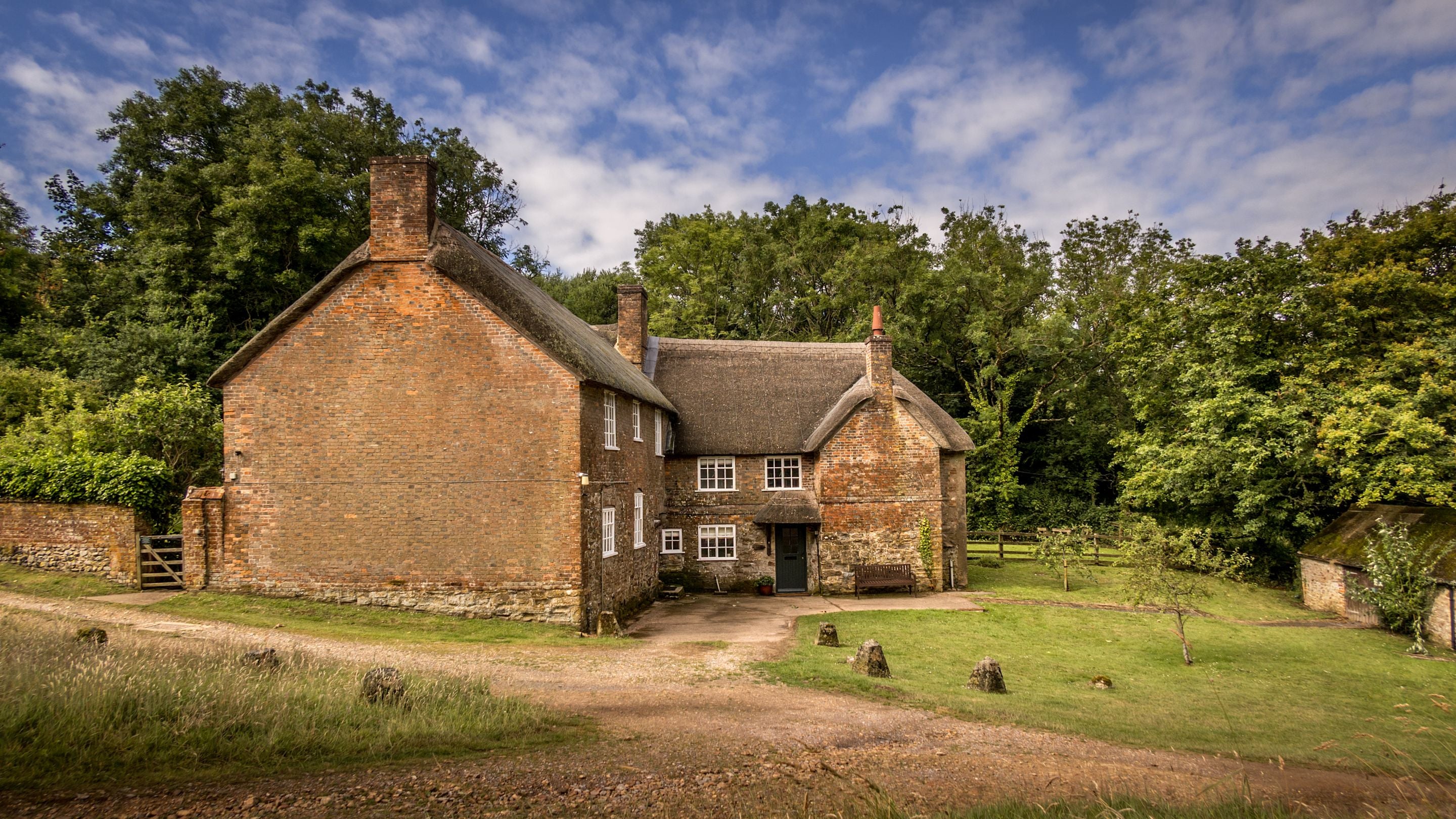 A view of St Gabriel’s Cottages, showing the front door of Beech Cottage, Dorset
