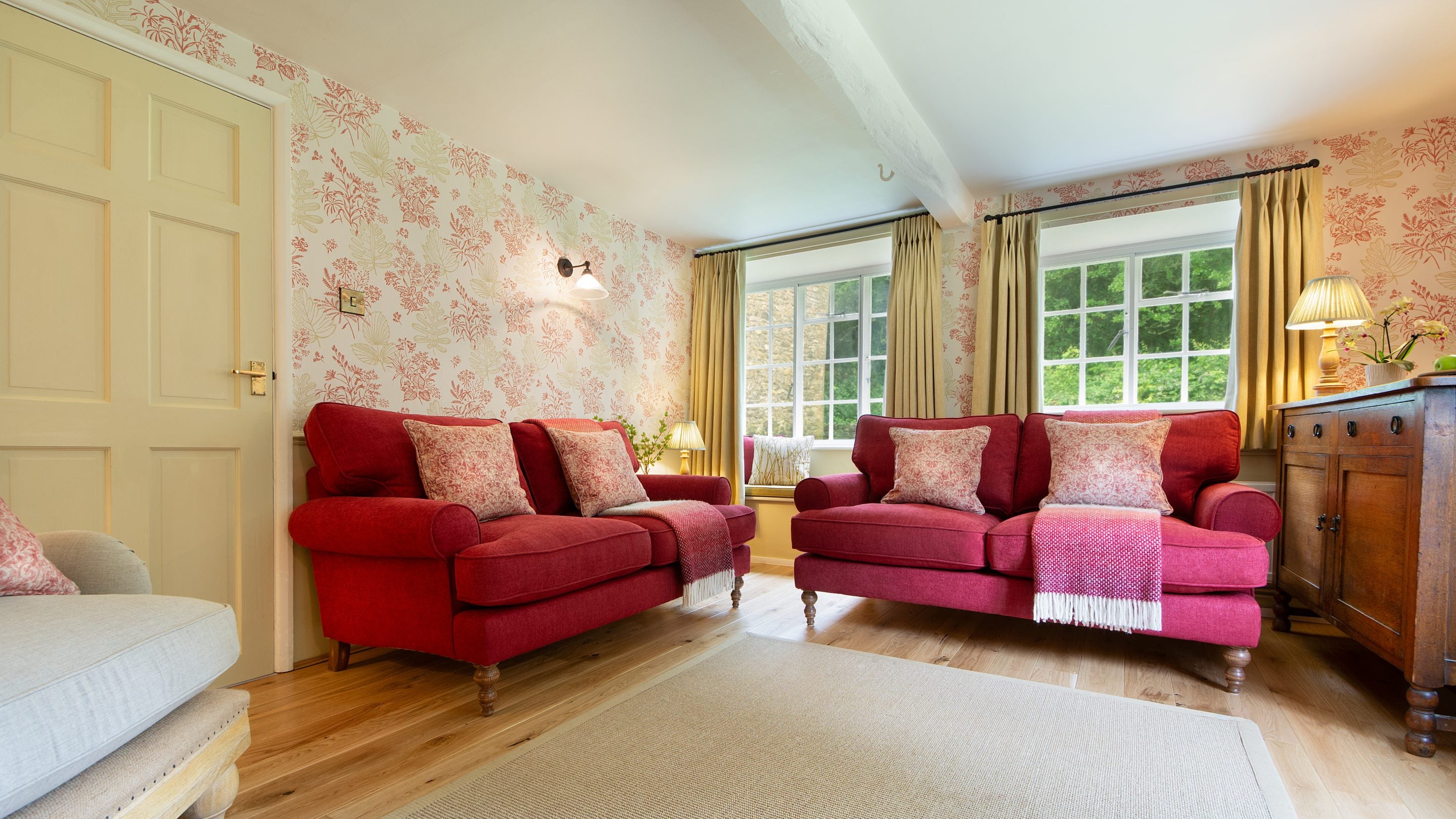 The sitting room with sofas and an armchair at Beech Cottage, Dorset