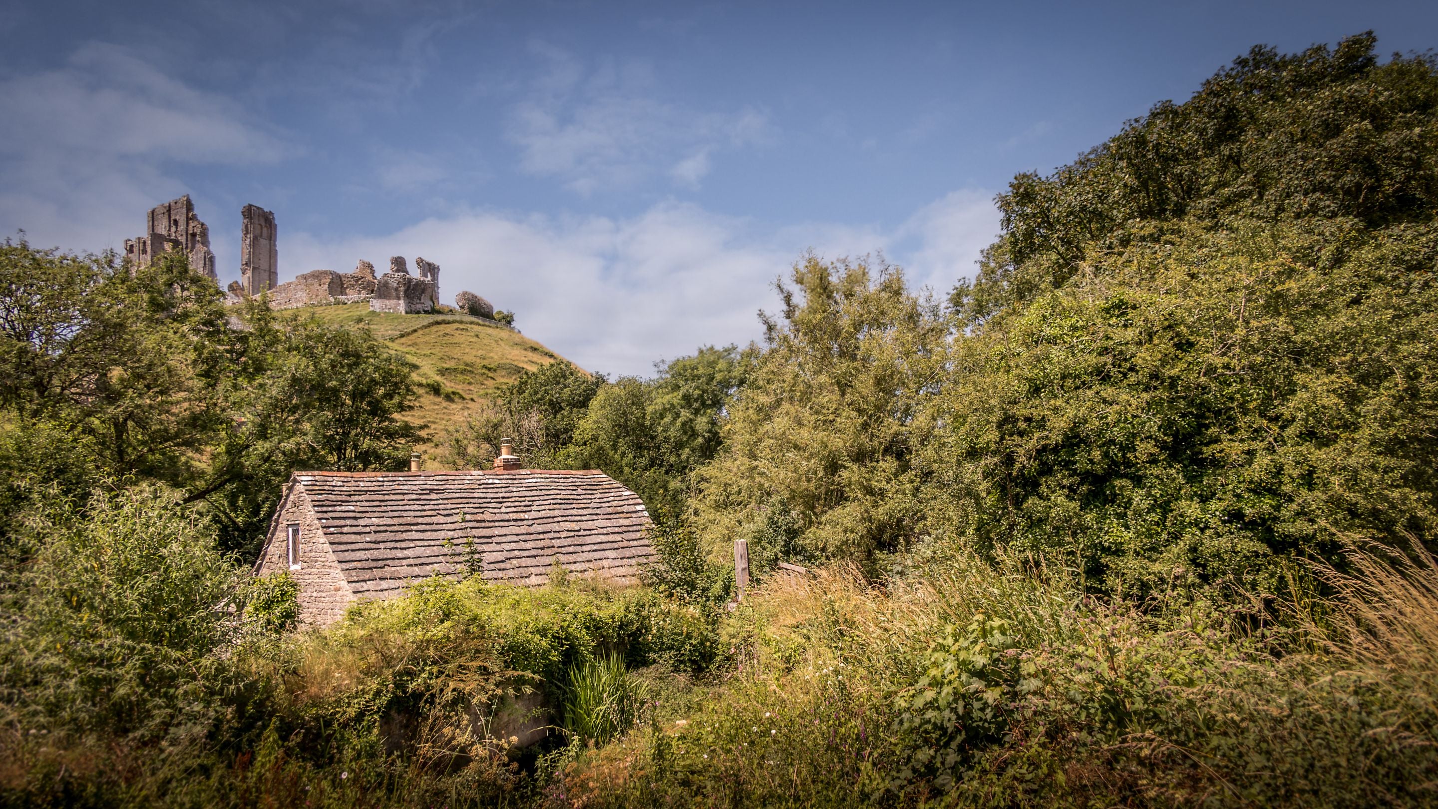 The ruins of Corfe Castle at the top of the hill above Boar Mill Cottage, Dorset