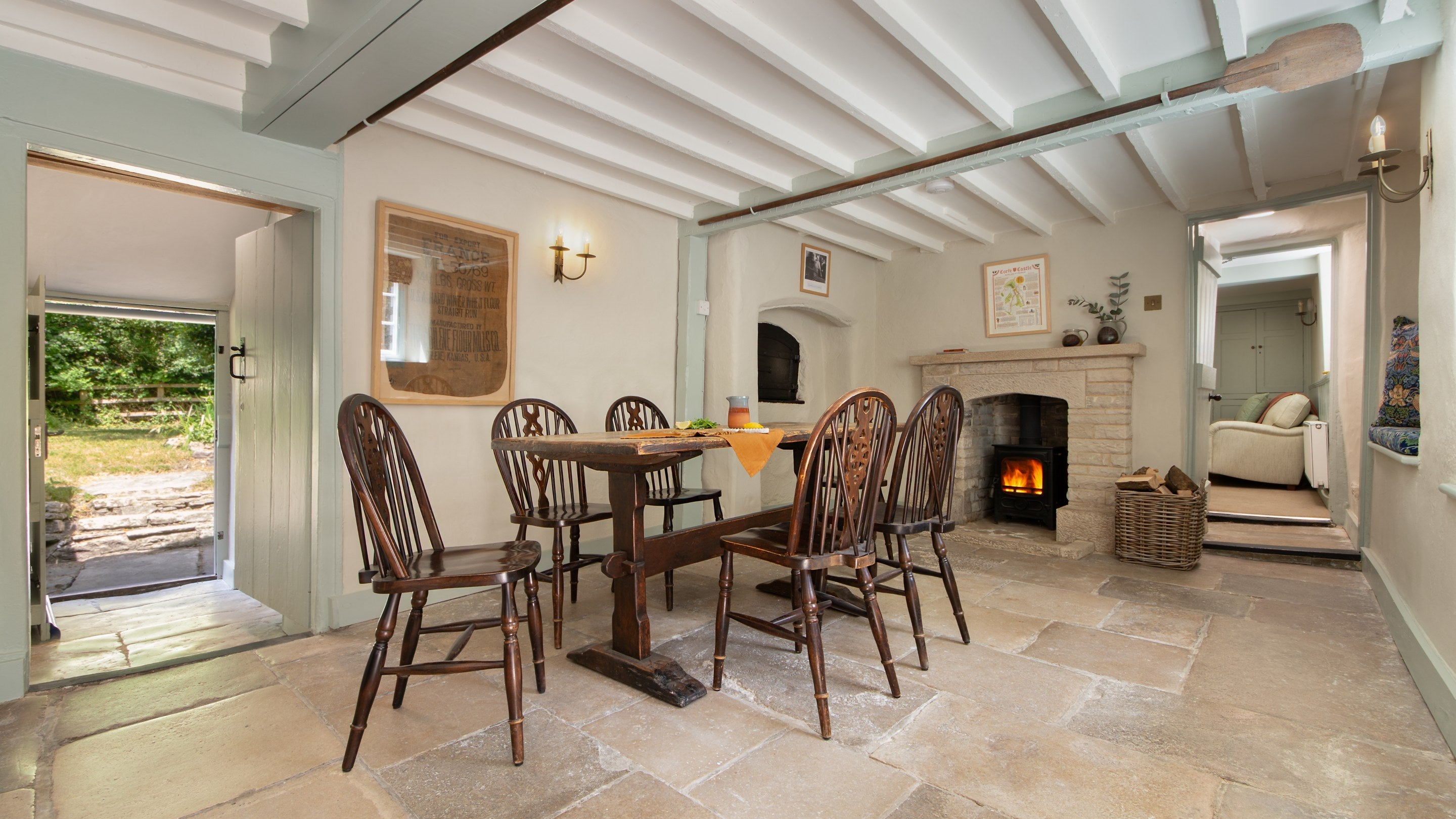 The dining room with woodburner at Boar Mill Cottage, Dorset
