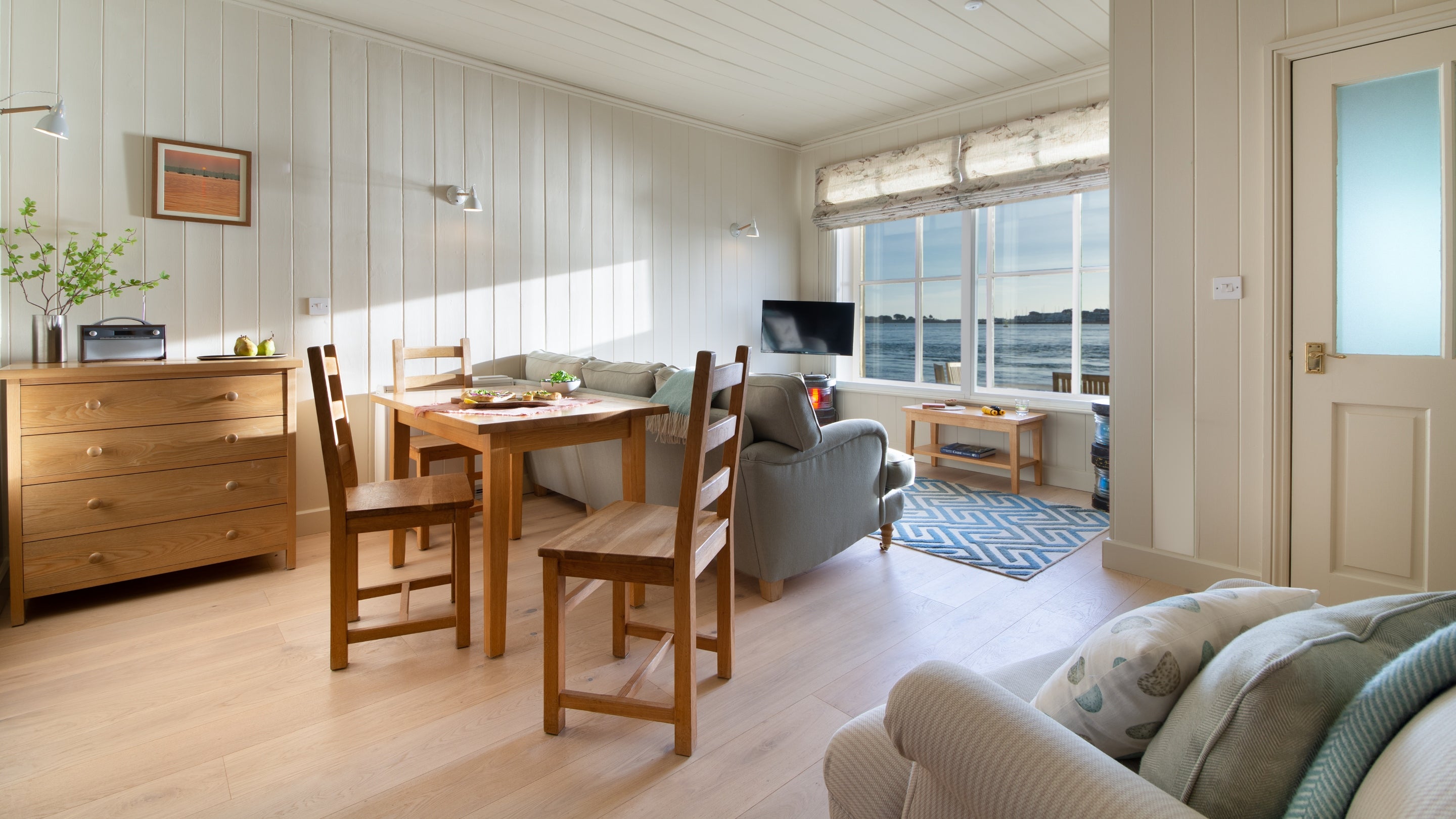 The open plan sitting, dining and bedroom at Custom House, Dorset