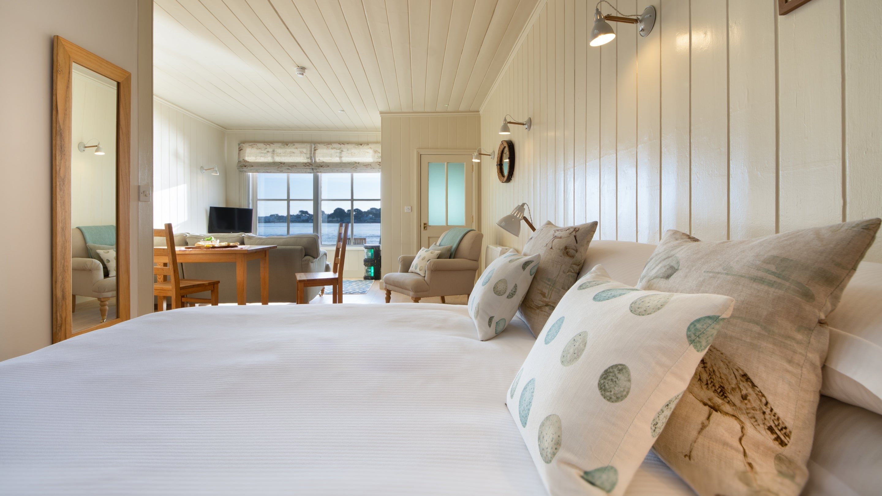 The open plan sitting, dining and bedroom at Custom House, Dorset
