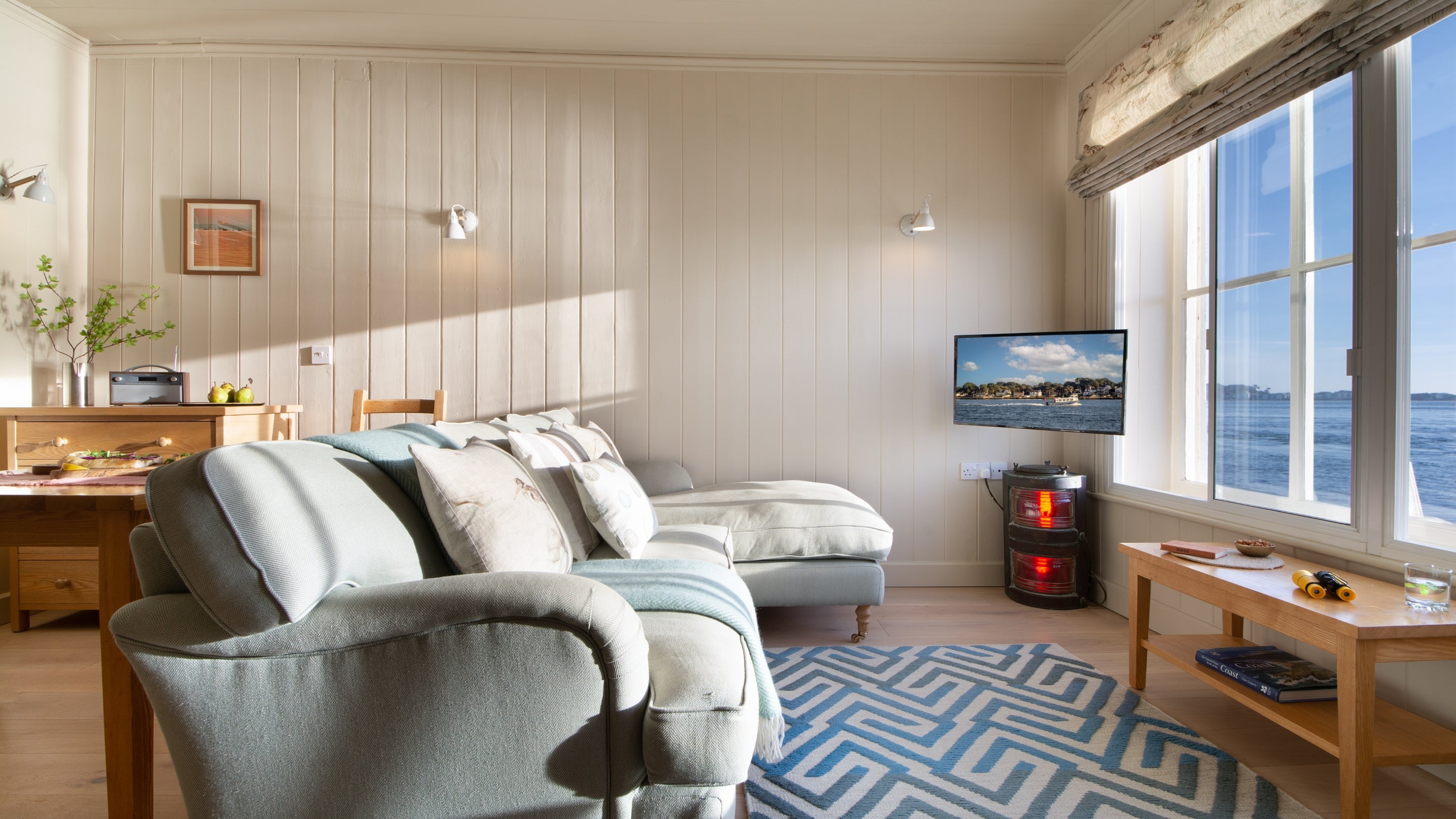 The open plan sitting, dining and bedroom at Custom House, Dorset