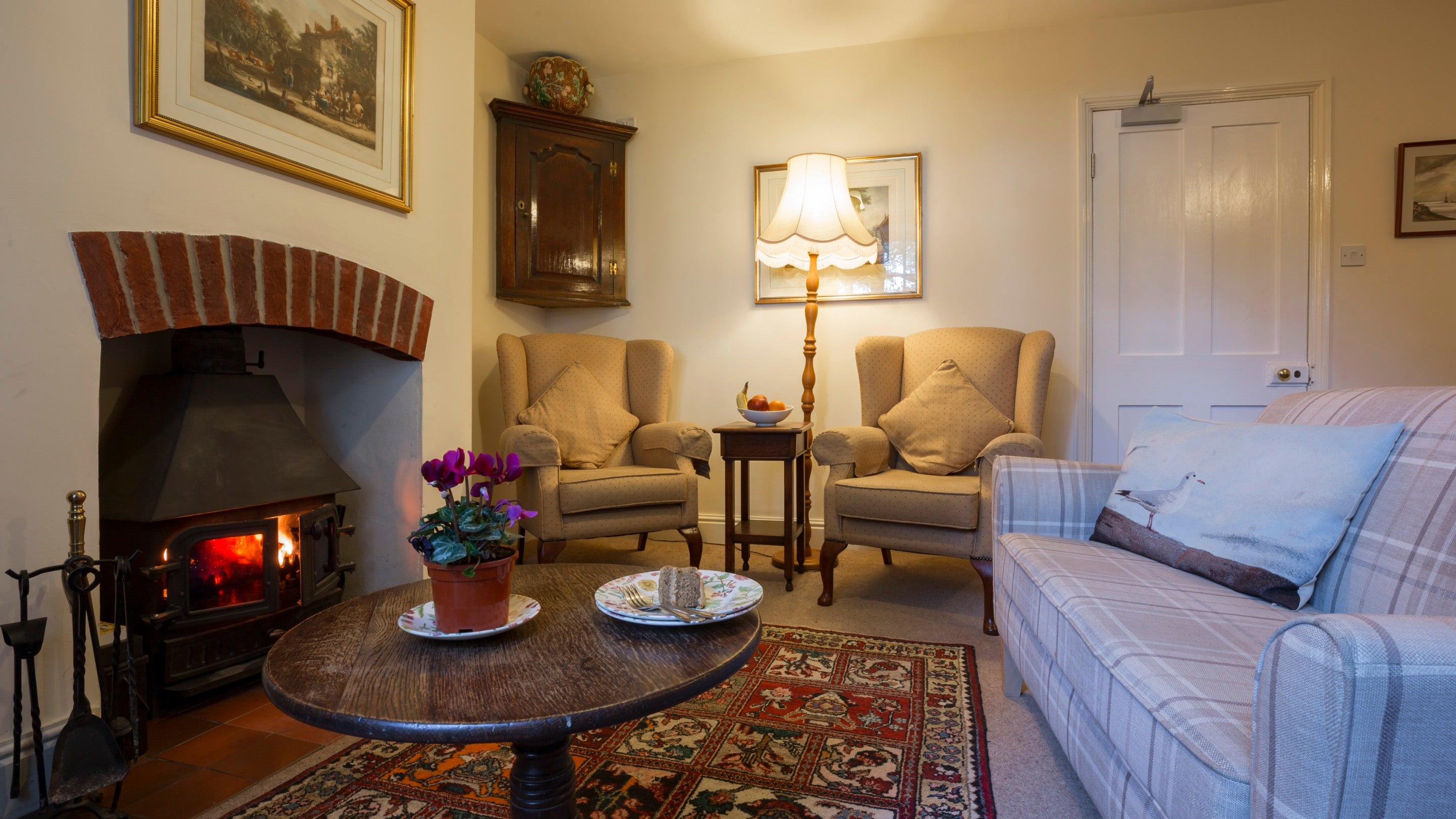 The sitting room with wood burner at Downhouse Farm Cottage, Dorset