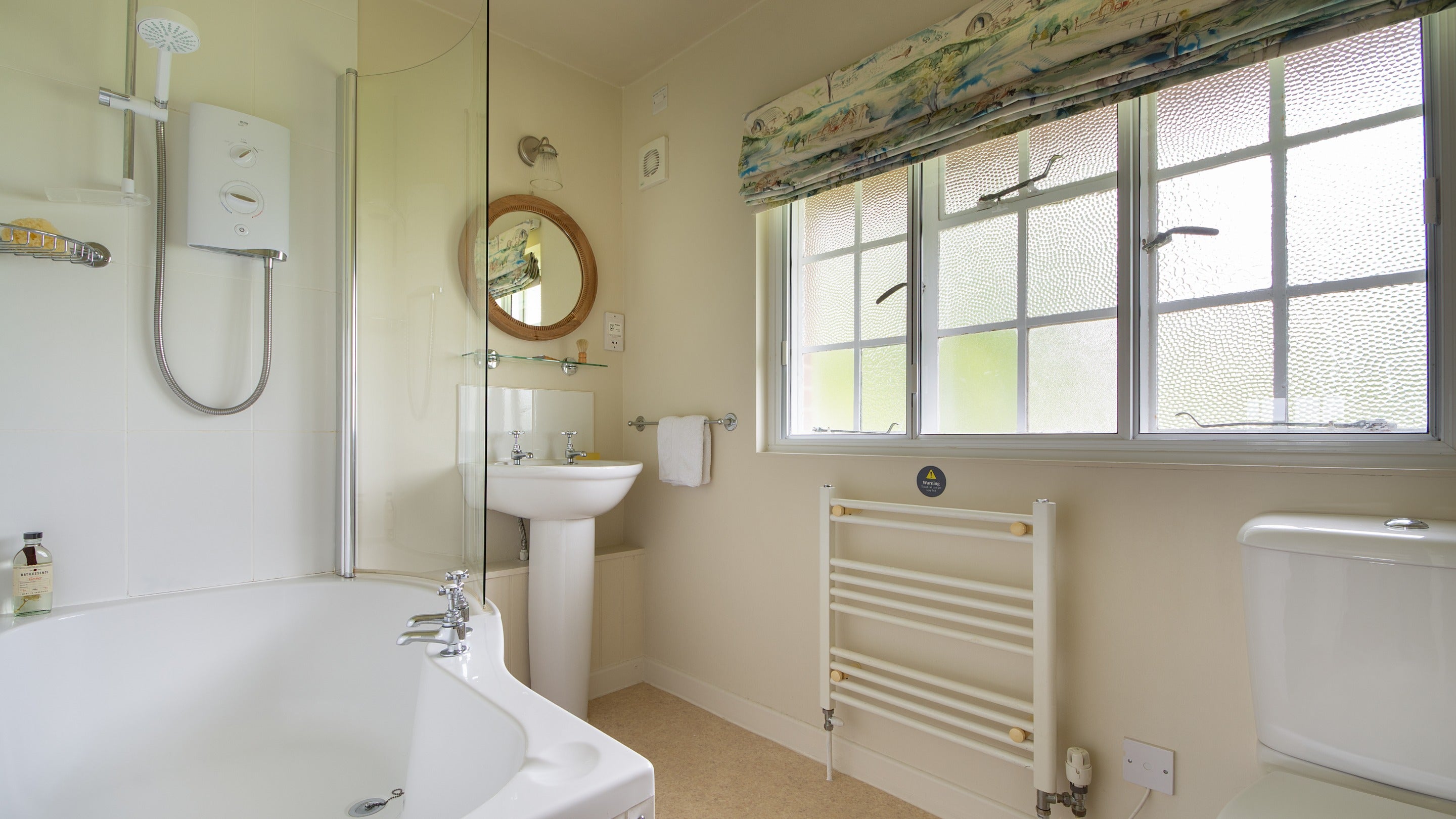 The bathroom at Greenlands, with shower over bath, Dorset