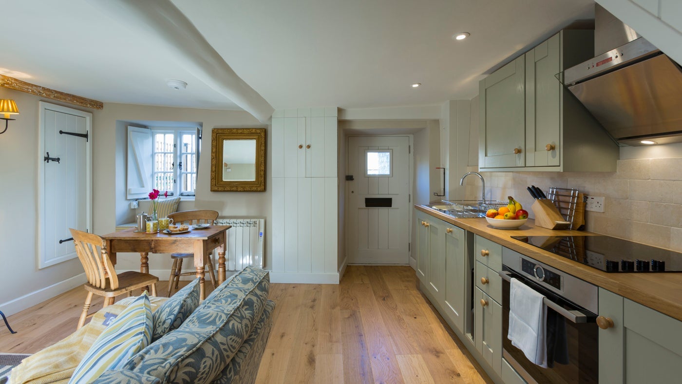The kitchen, dining and sitting room at Groom's Cottage, Corfe Castle, Dorset