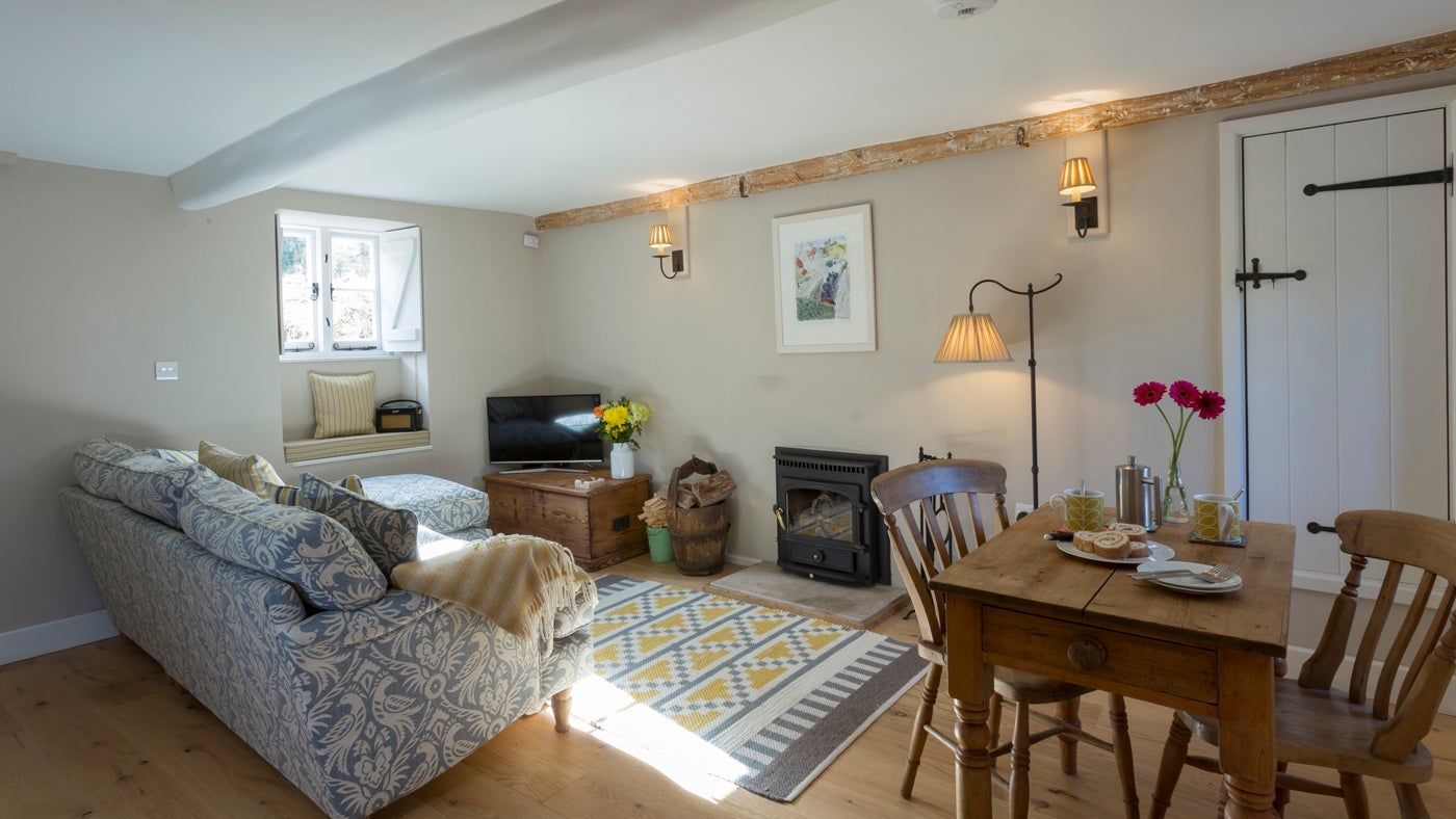 The kitchen, dining and sitting room at Groom's Cottage, Corfe Castle, Dorset