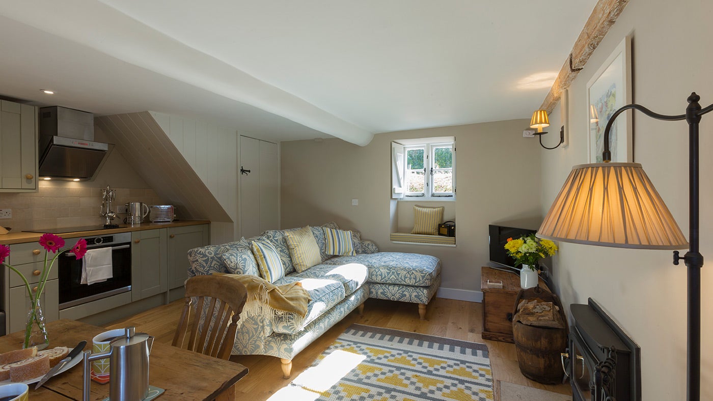 The open plan kitchen, dining and sitting room at Groom’s Cottage, Dorset
