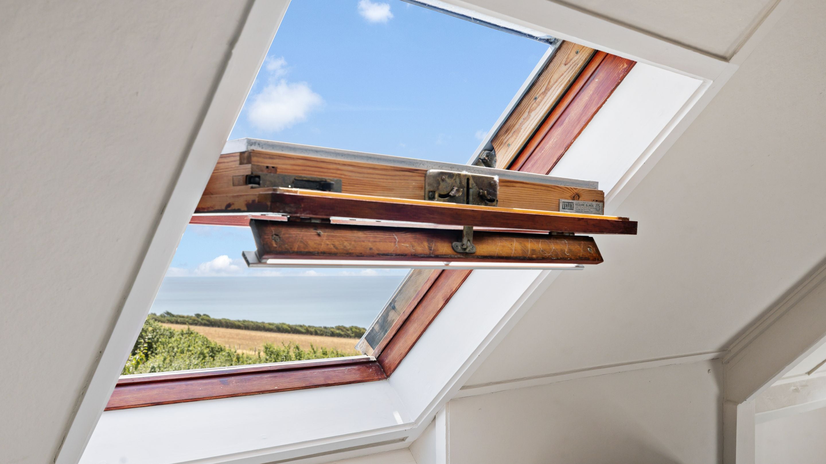 The view from an open window in the attic room at Labour in Vain Cottage, Dorset