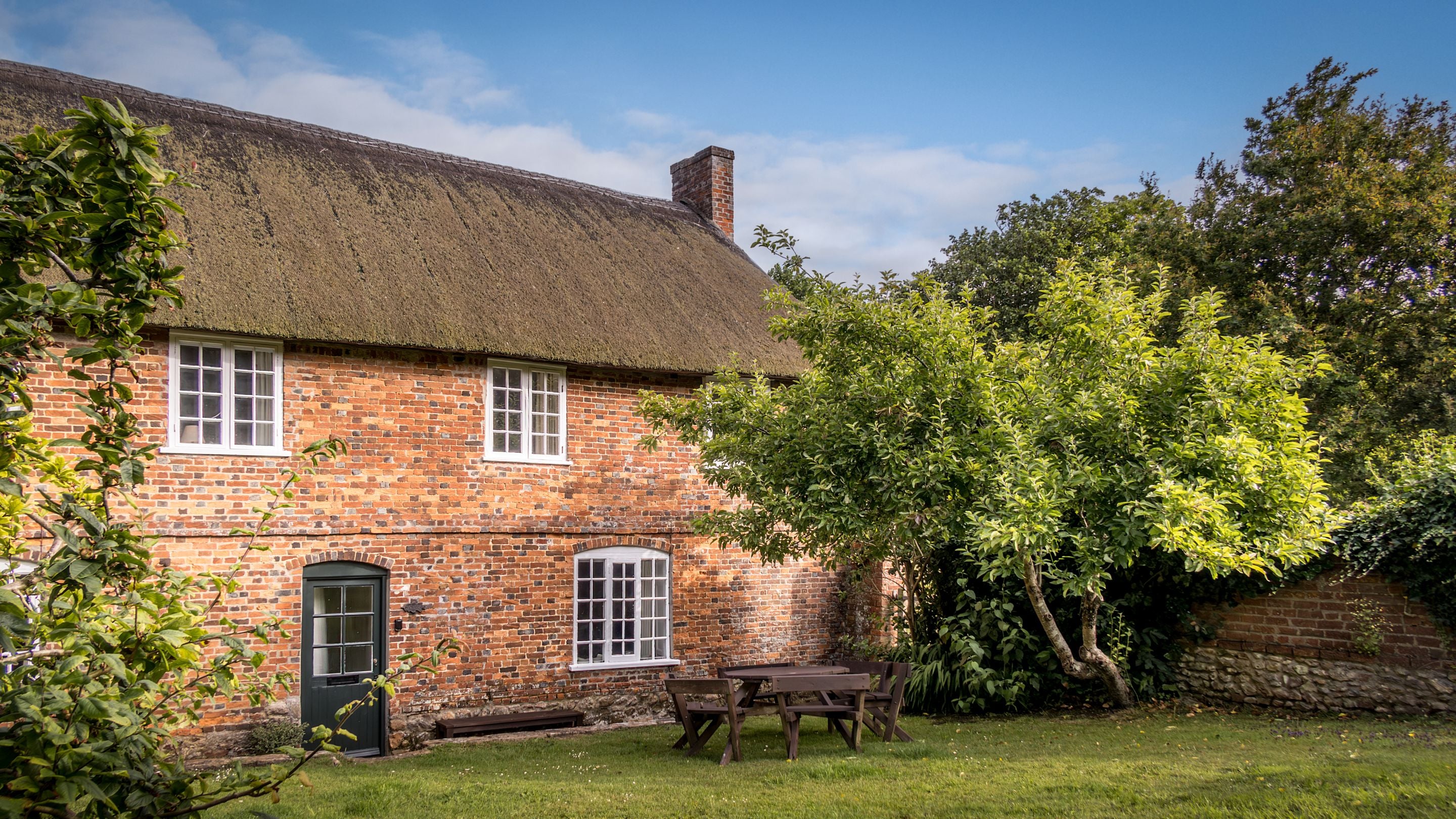 The exterior of Beech Cottage and the shared garden, Dorset