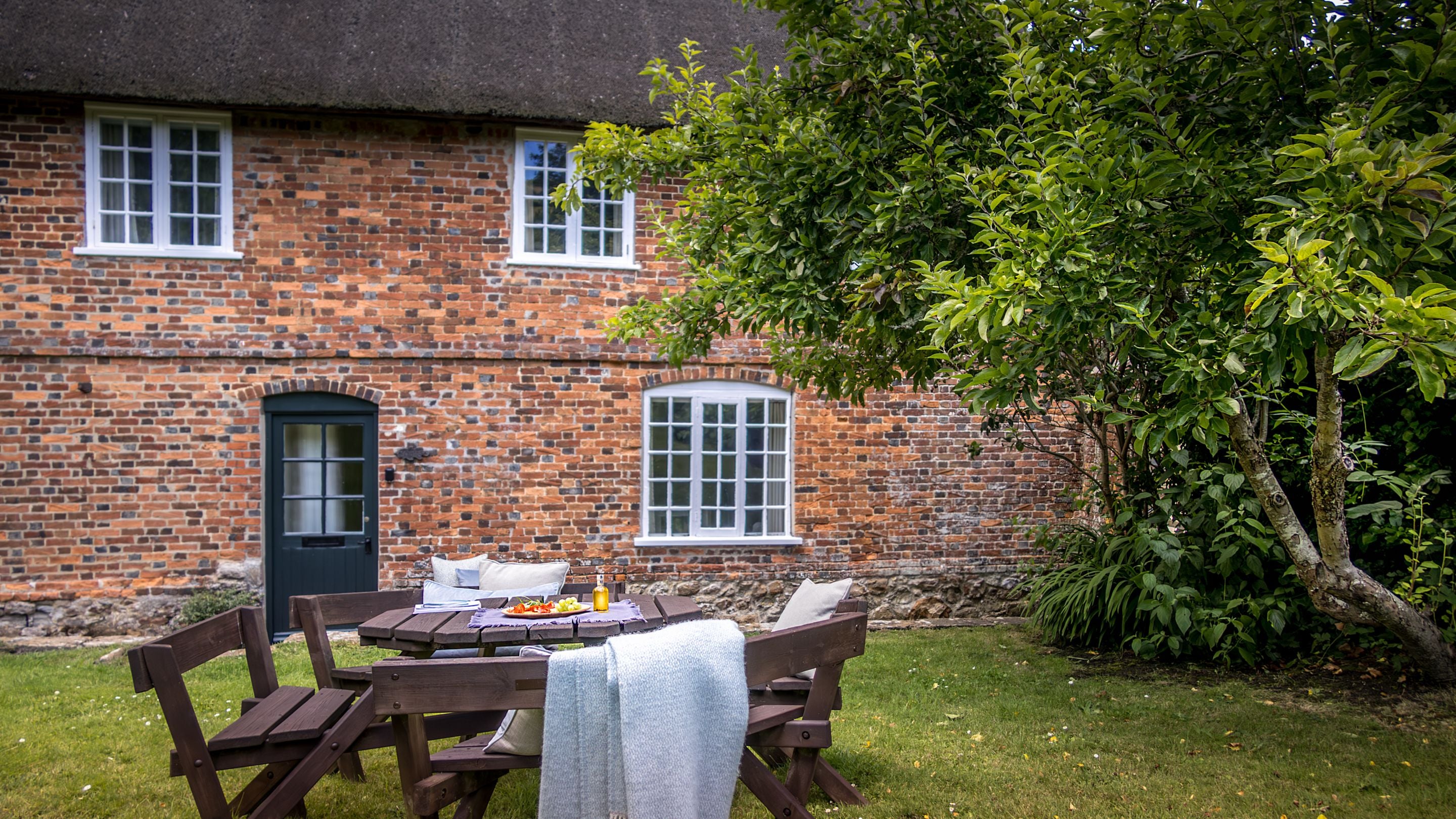 The exterior of Oak Cottage and it's picnic table, Dorset