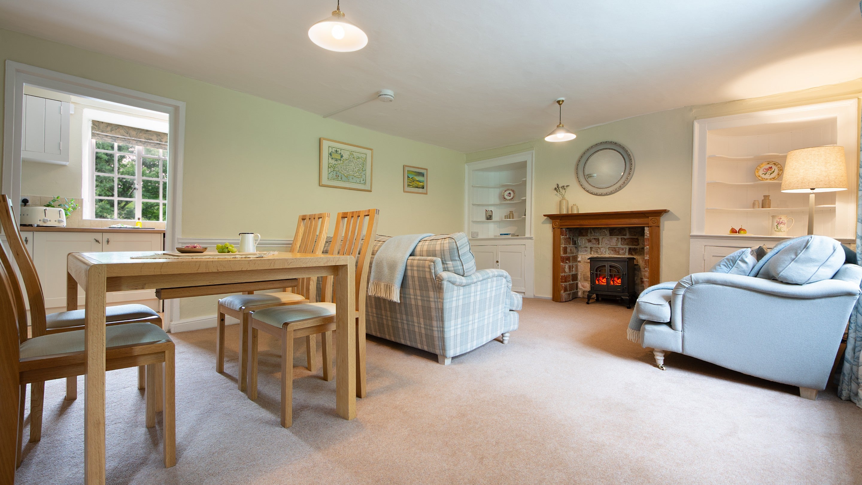 The open-plan sitting and dining room at Oak Cottage, Dorset