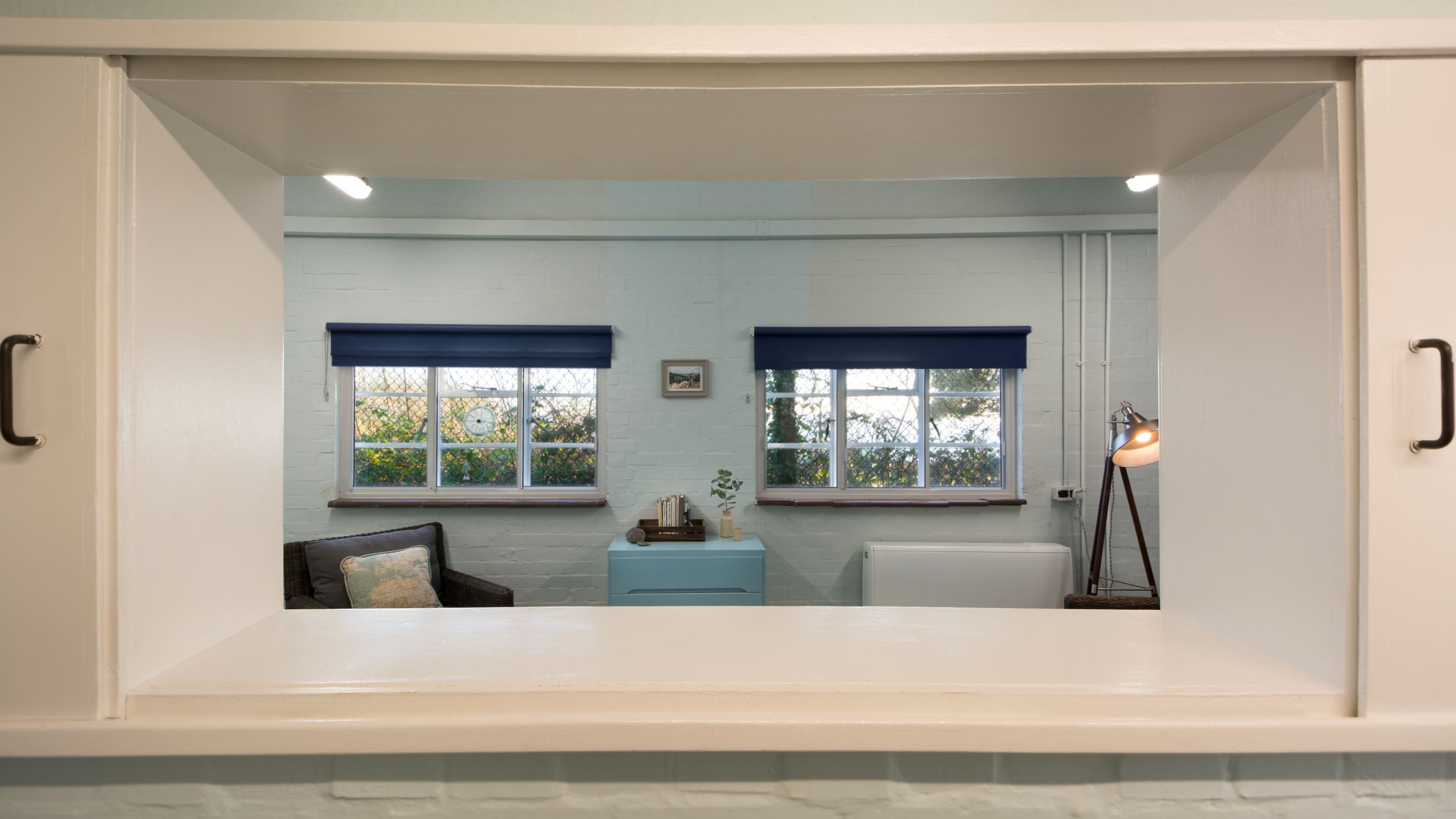 Looking through the hatch in the dining room to the sitting room at the Old Radar Station, Dorset