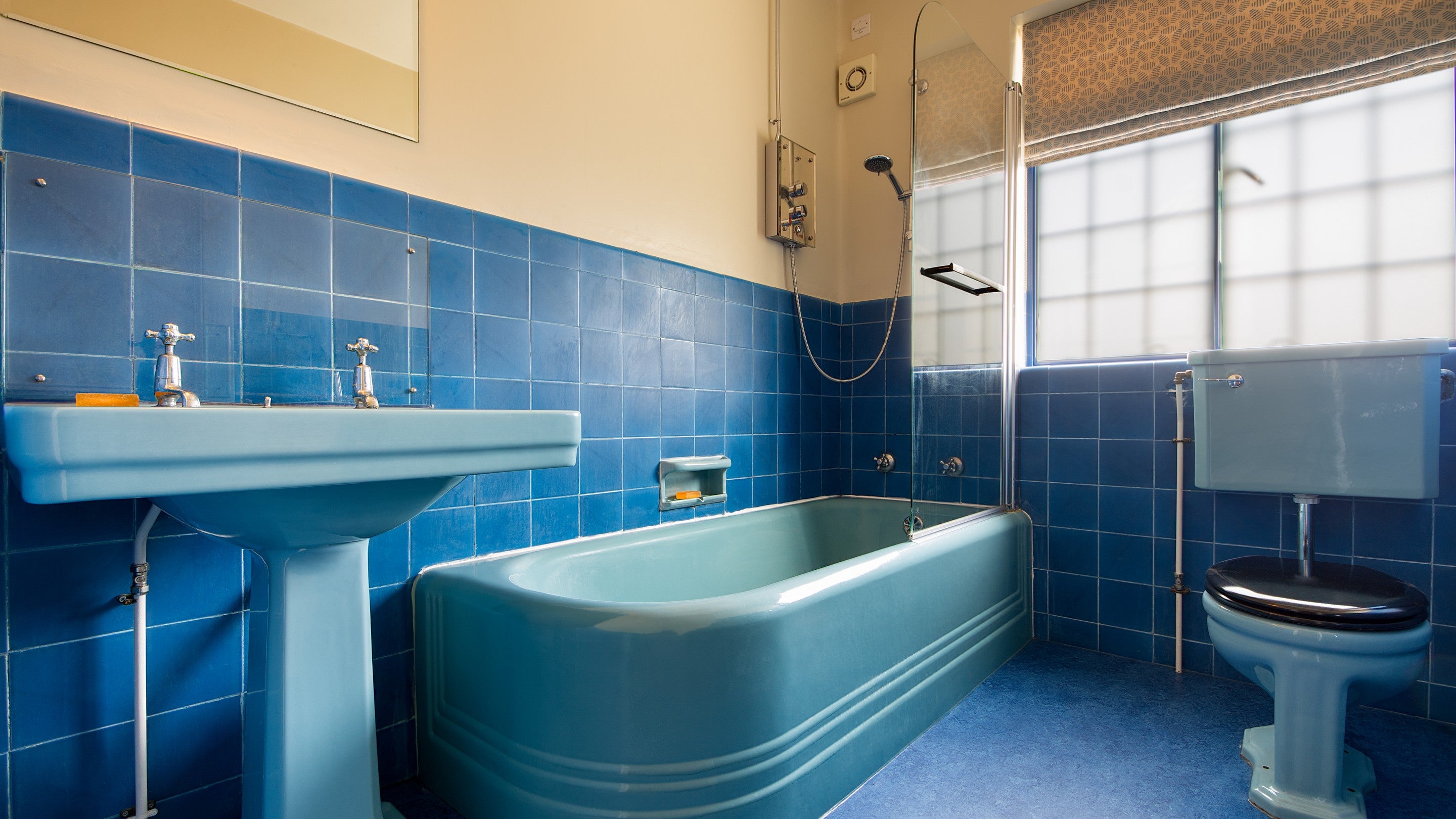 One of the bathrooms on the first floor at Portland House, with shower over bath, Dorset