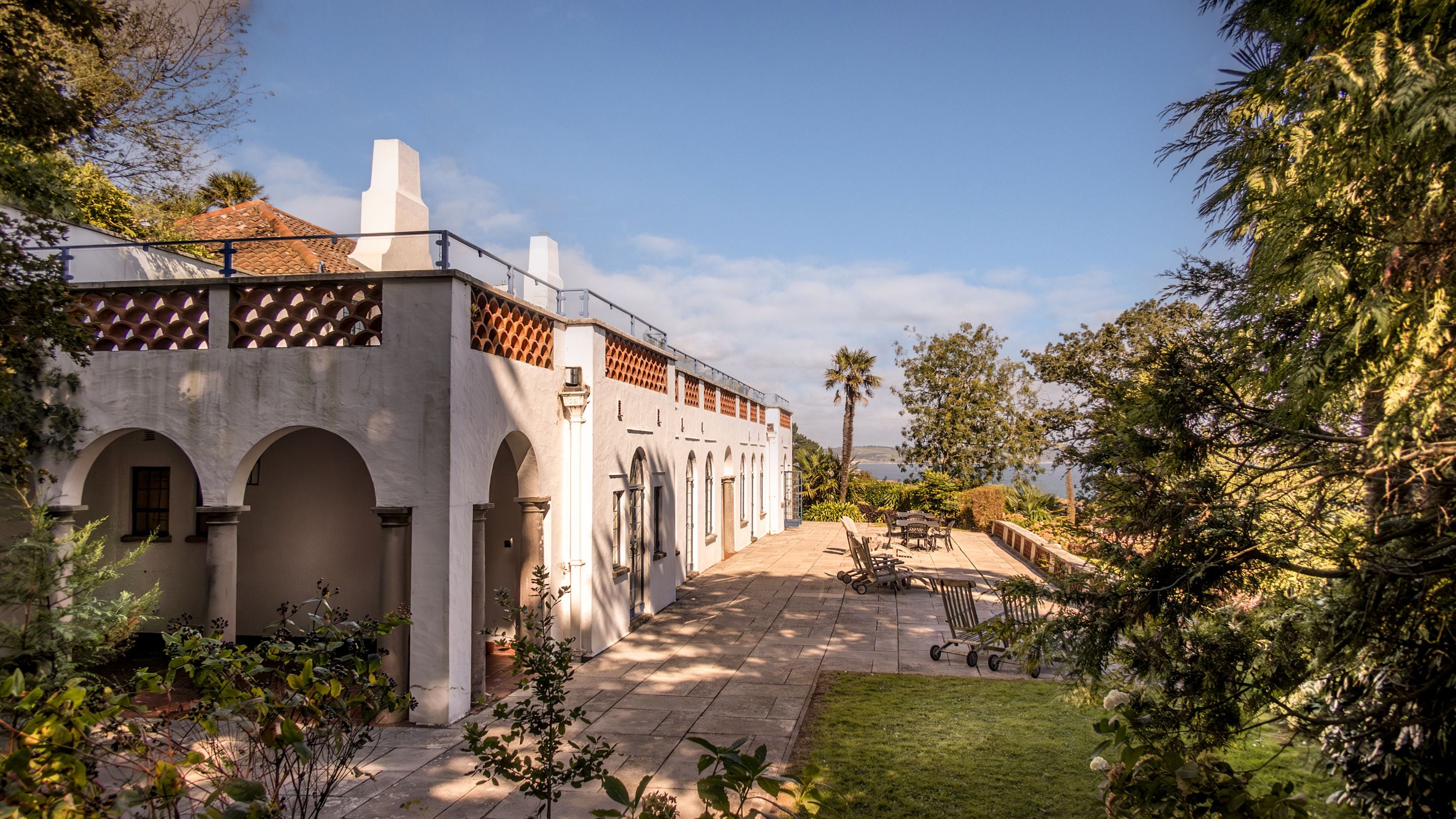 The exterior of Portland House, with Weymouth Bay in the distance, Dorset