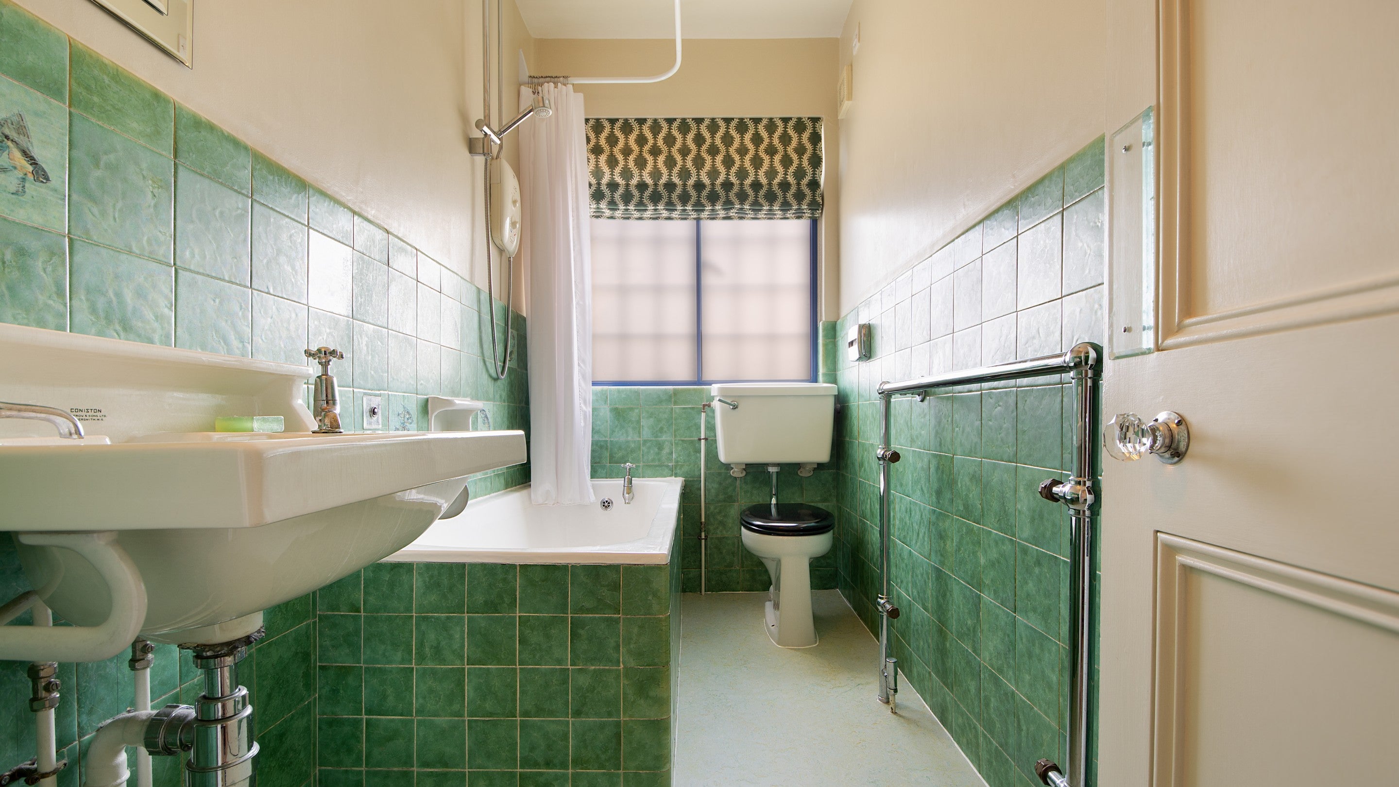 One of the bathrooms on the first floor of Portland House, with shower over bath, Dorset