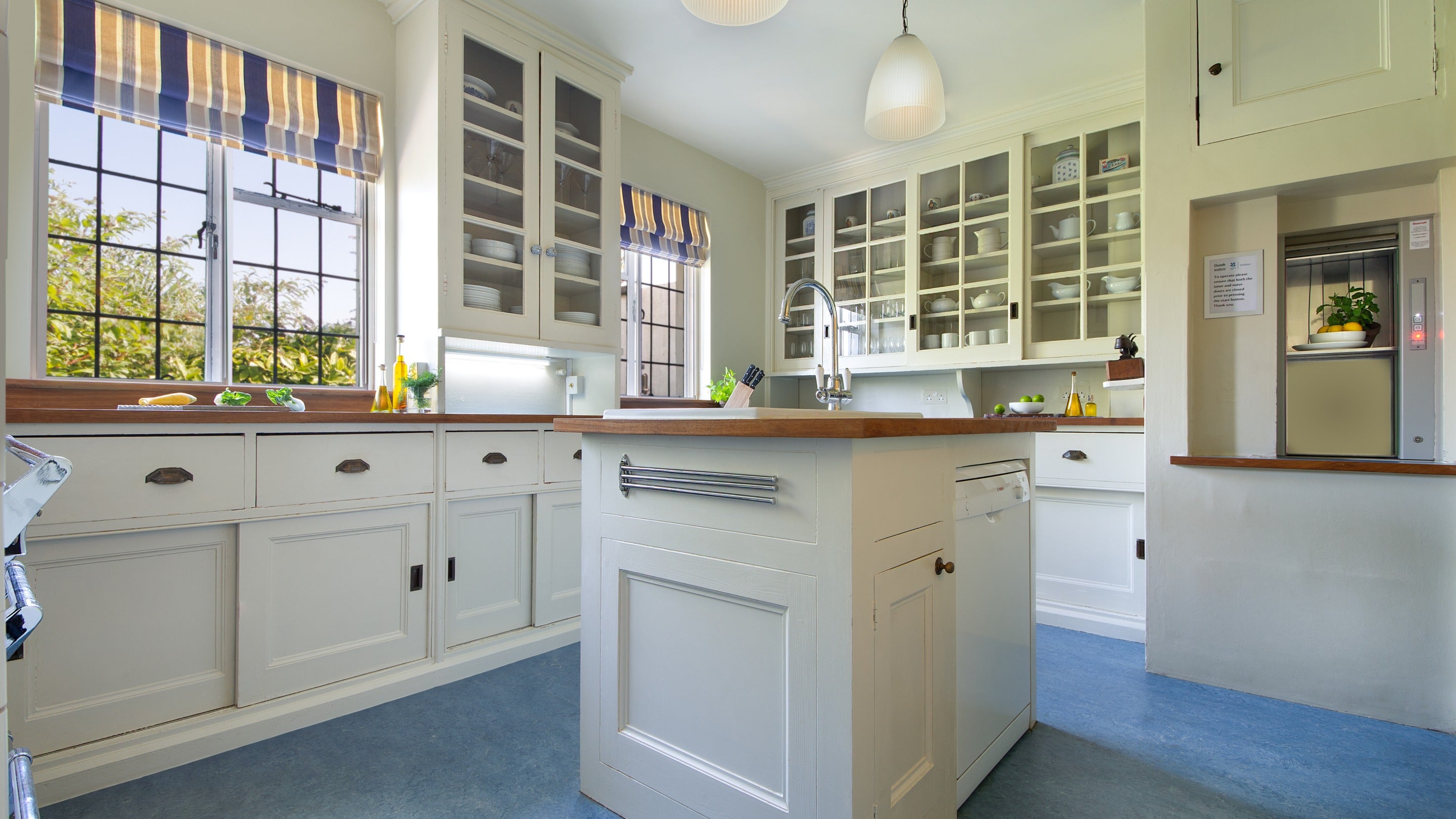 The kitchen on the first floor of Portland House, showing the dumbwaiter, which goes to the dining room on the lower floor, Dorset