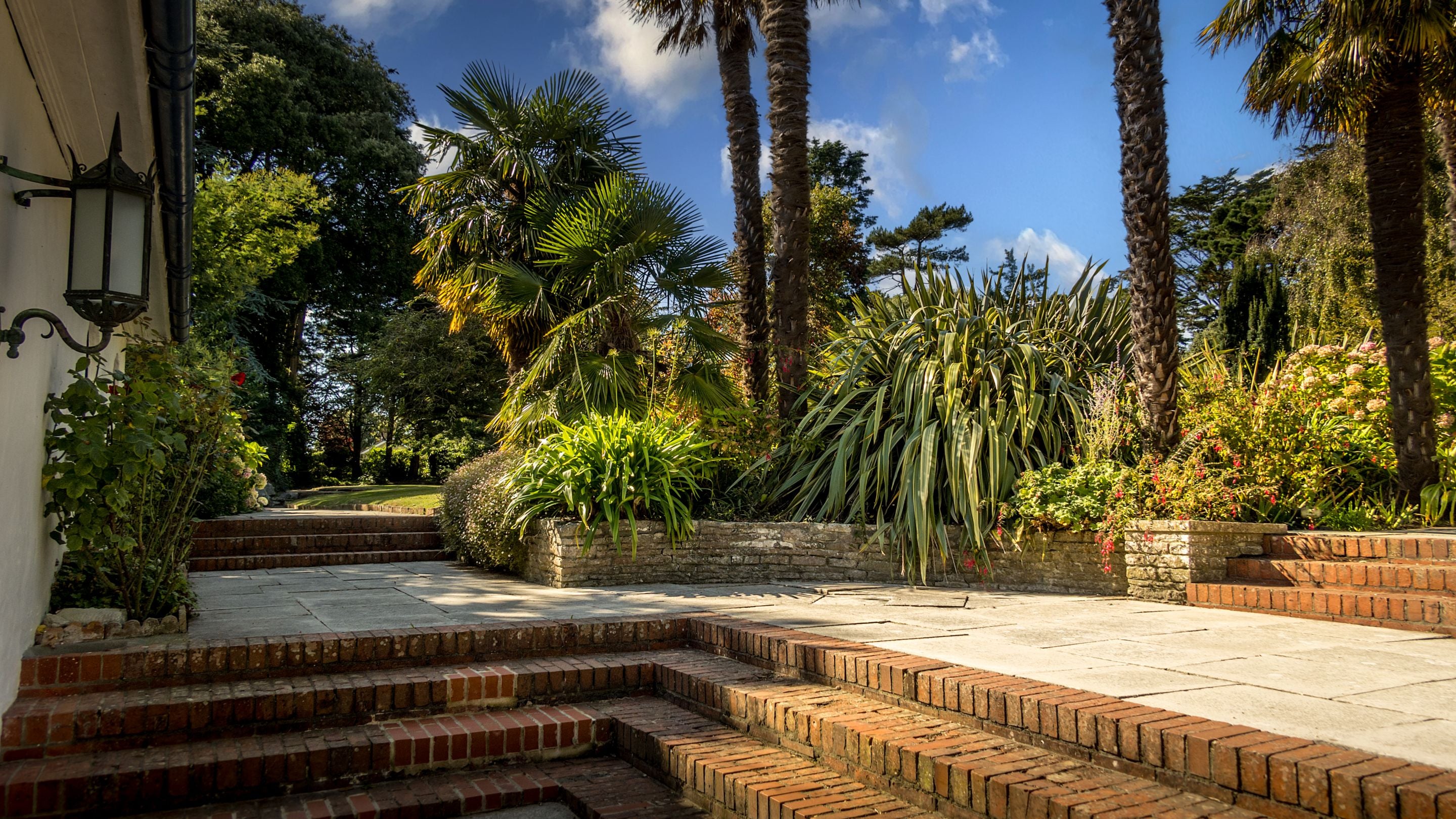 Steps down from the garden to the entrance door to Portland House, Dorset