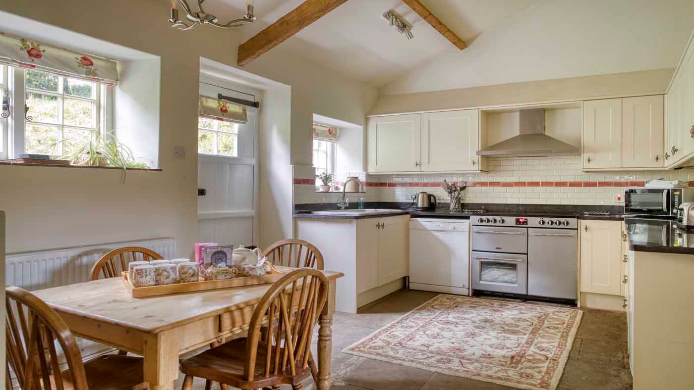 Interior kitchen and dining area of Shedbush Farmhouse, nr Bridport, Dorset