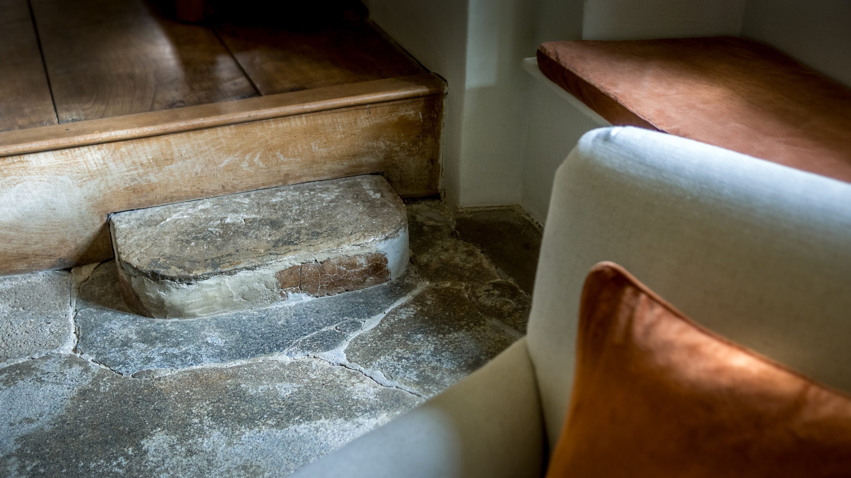 The step up to the dining area in the open-plan sitting and dining room at Shedbush Farm House, Dorset