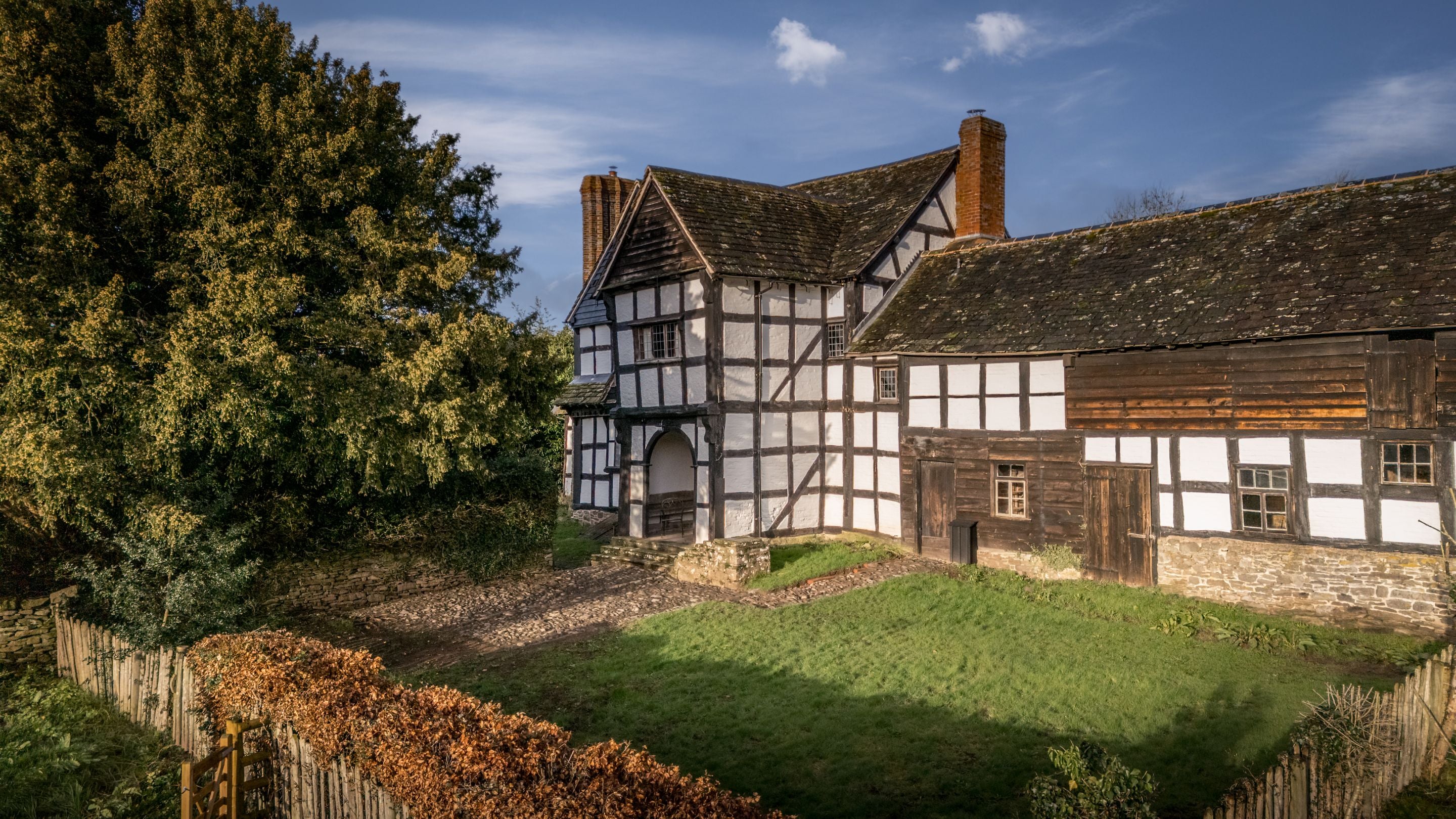 An aerial view of Cwmmau Farmhouse and part of its garden, Herefordshire