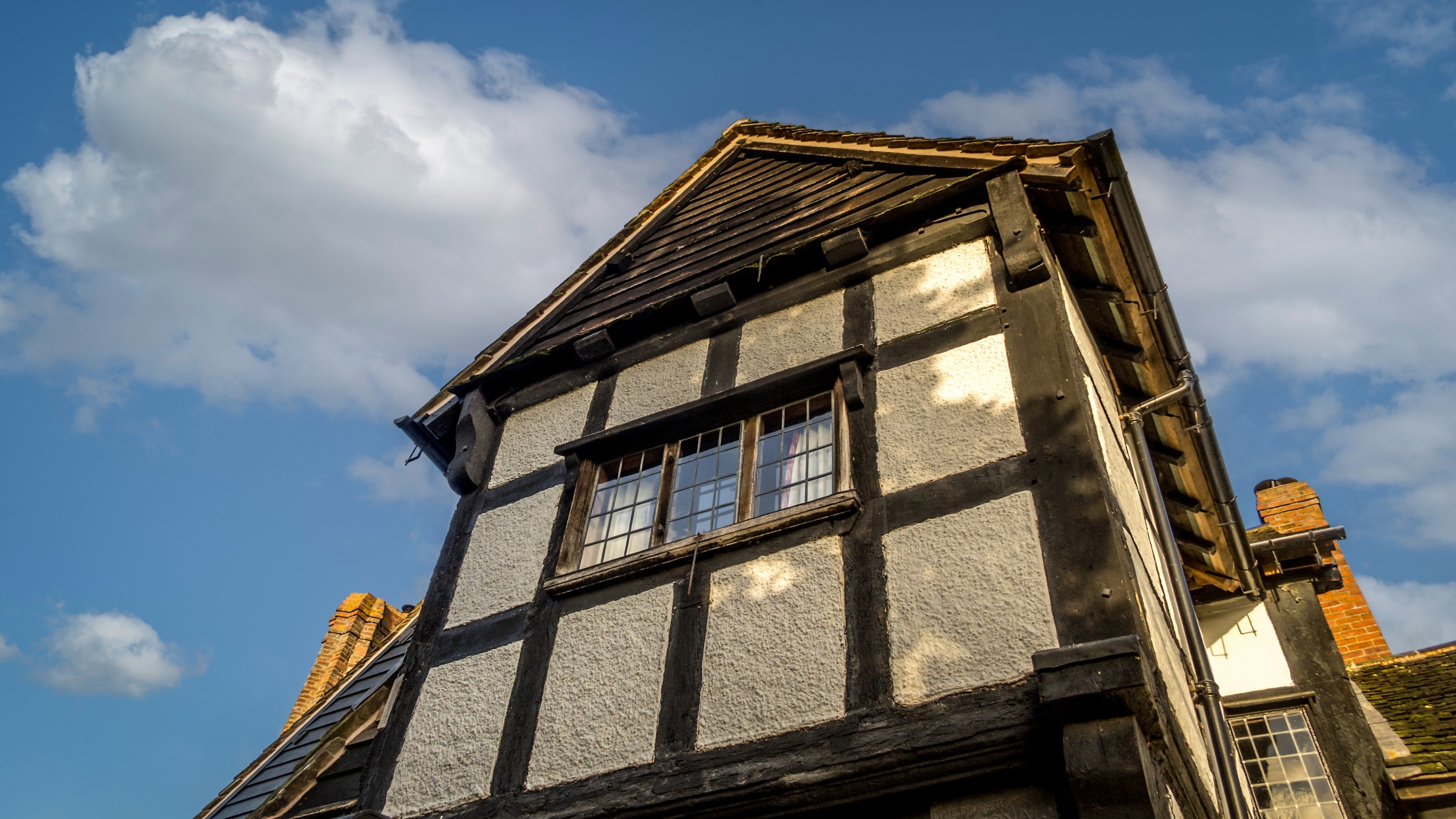 In the garden, looking up at the bedroom above the porch at Cwmmau Farmhouse, Herefordshire