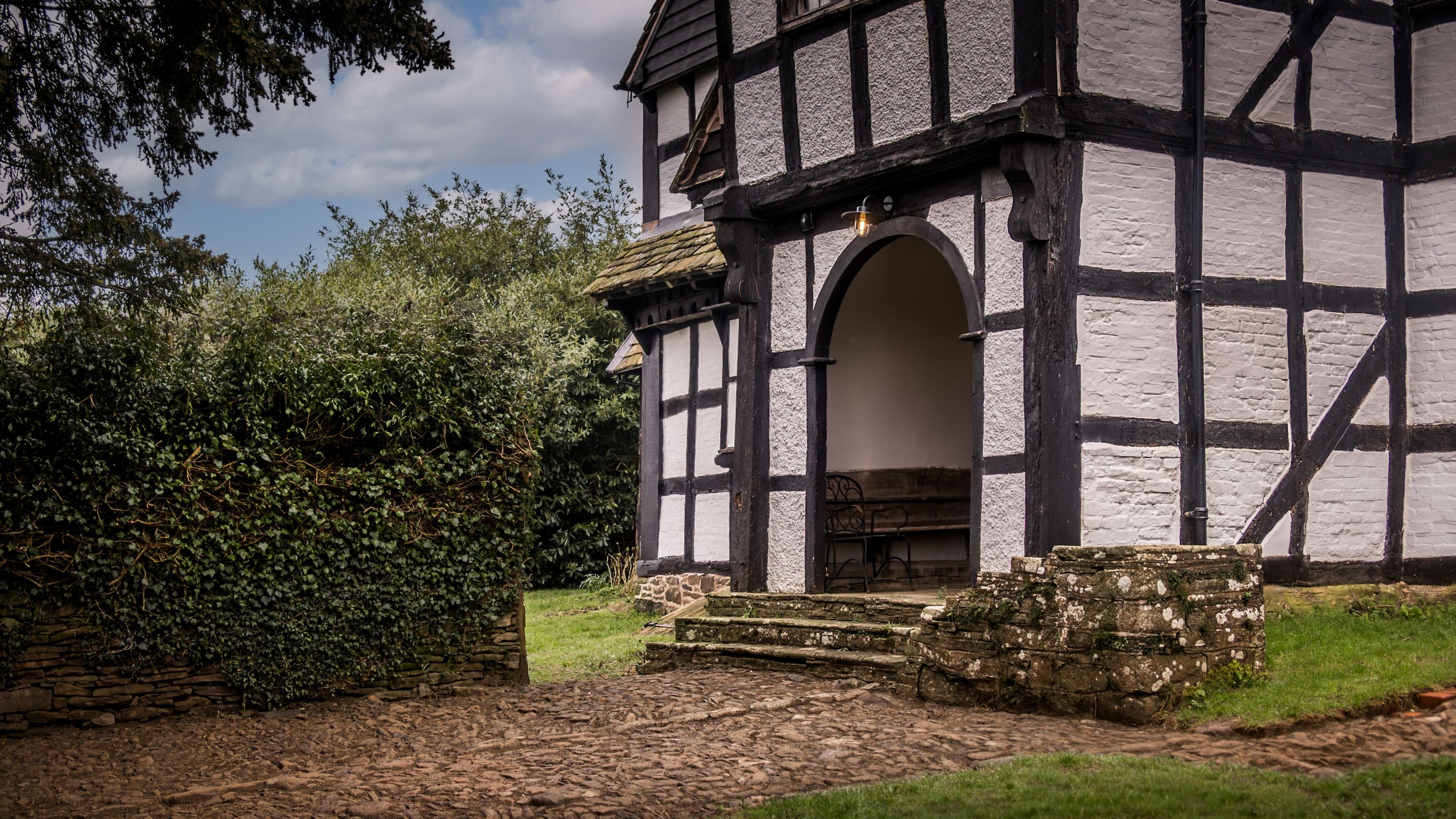 The garden and porch at Cwmmau Farmhouse, Herefordshire