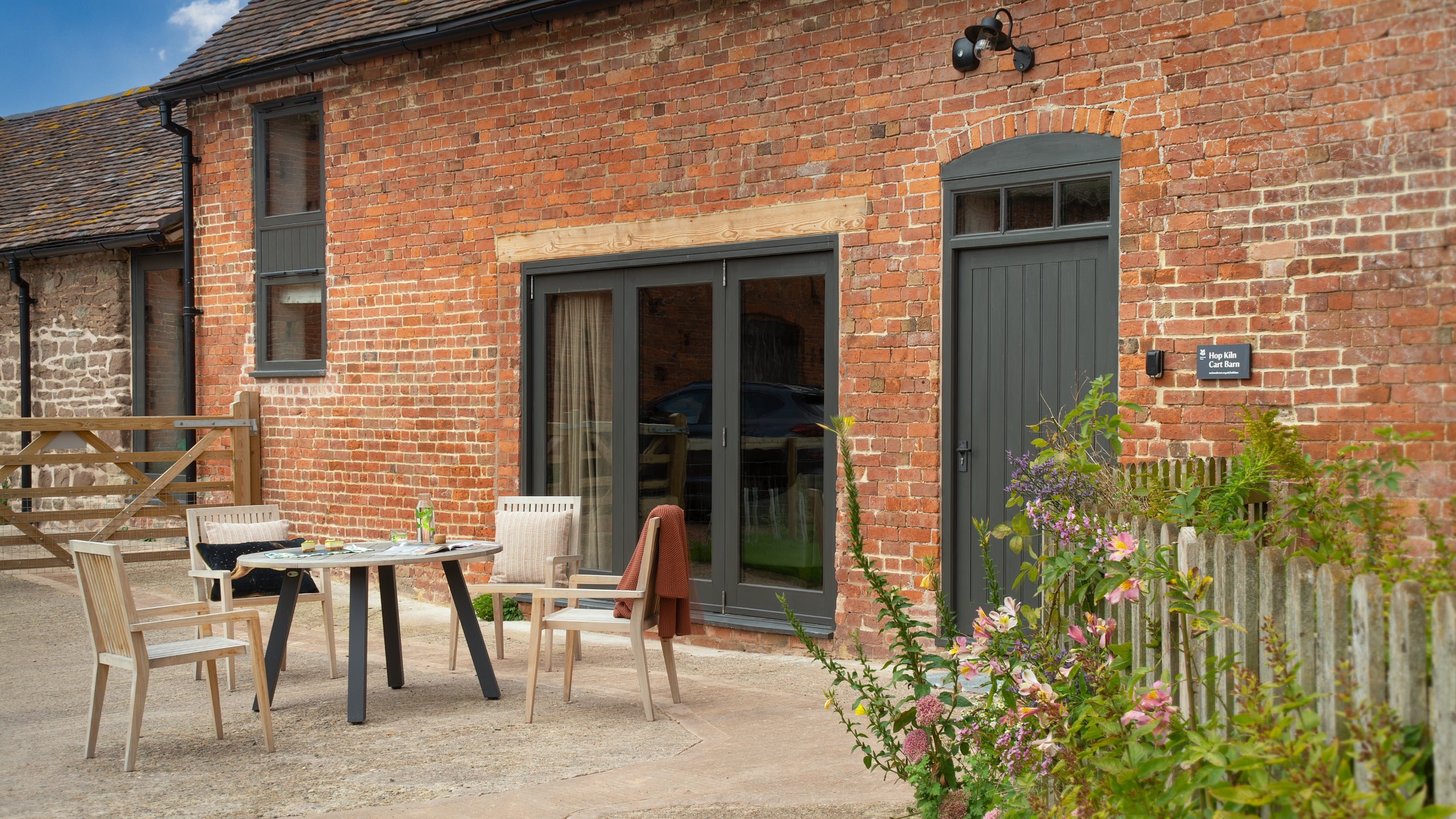 The outdoor seating area at Hop Kiln Cart Barn, Herefordshire