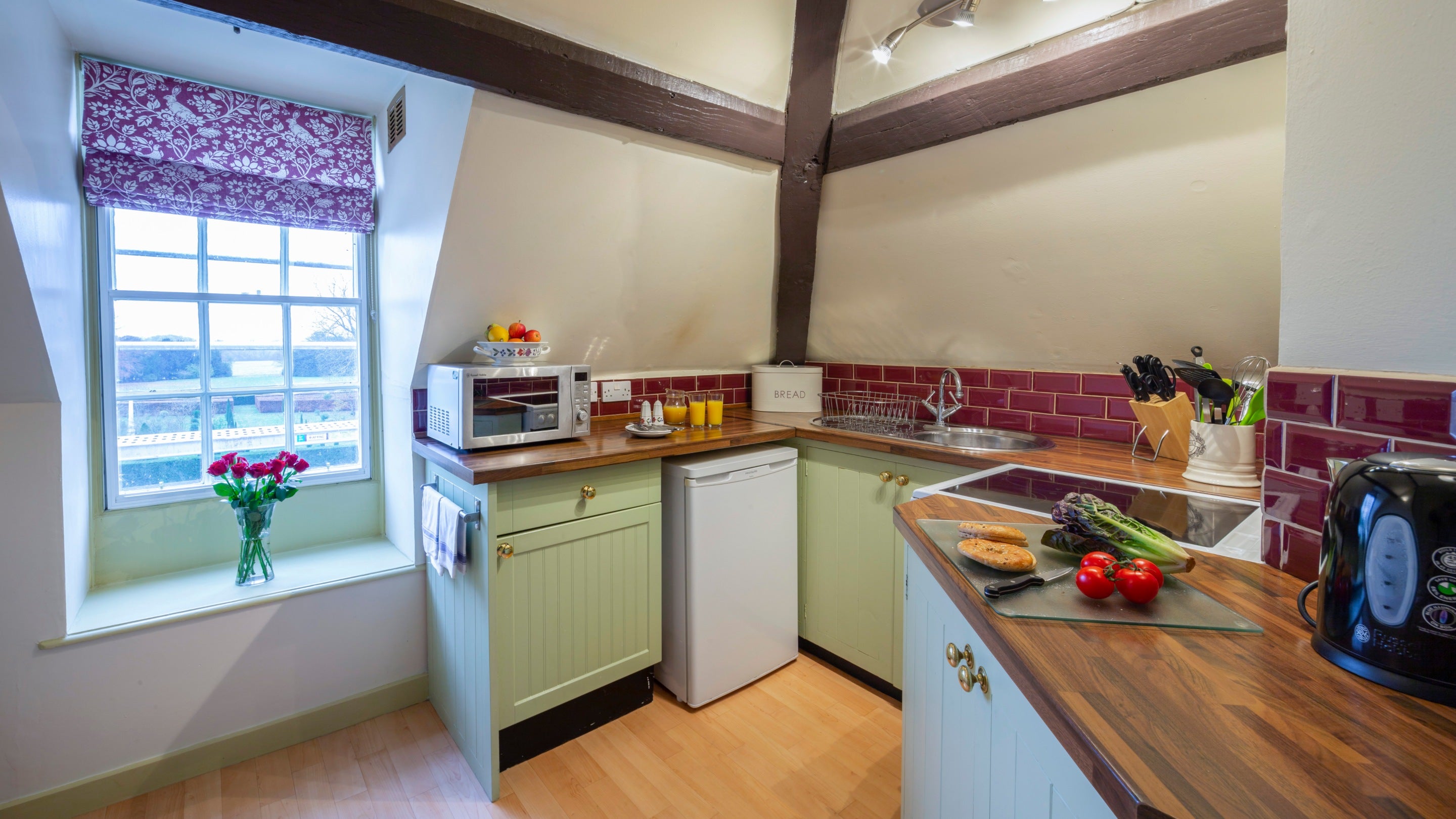 The kitchen at South Wing with window overlooking the gardens at Hanbury Hall, Worcestershire