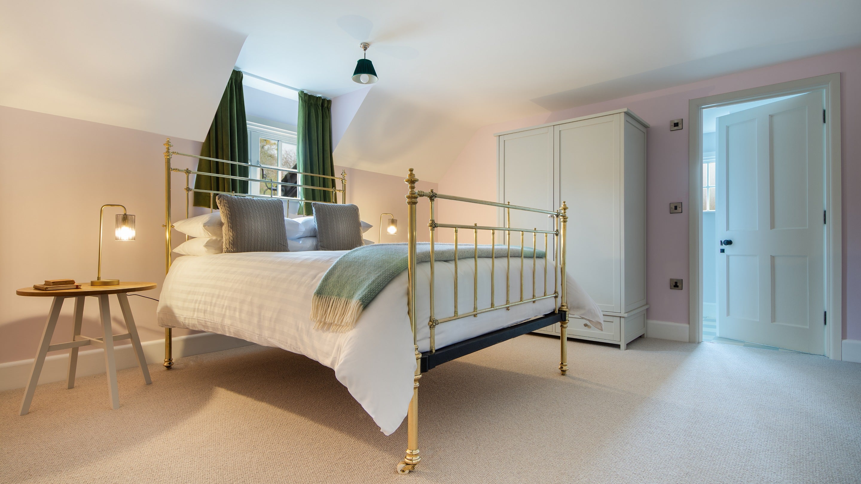One of the double bedrooms with en-suite at The Weir Garden Cottage, Herefordshire